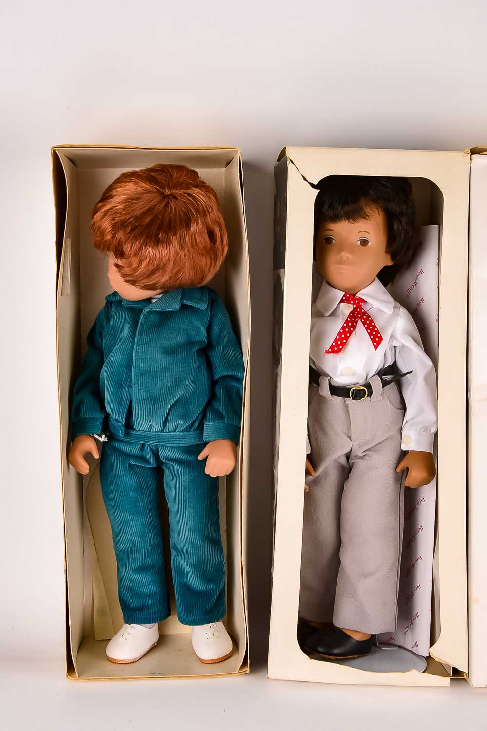 Collection of Eight "Sasha" Dolls, with Doll Trunk and Clothing