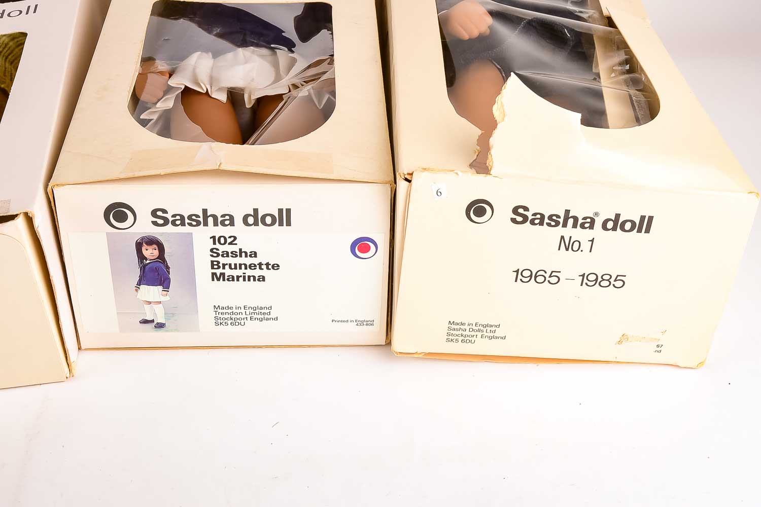 Collection of Eight "Sasha" Dolls, with Doll Trunk and Clothing