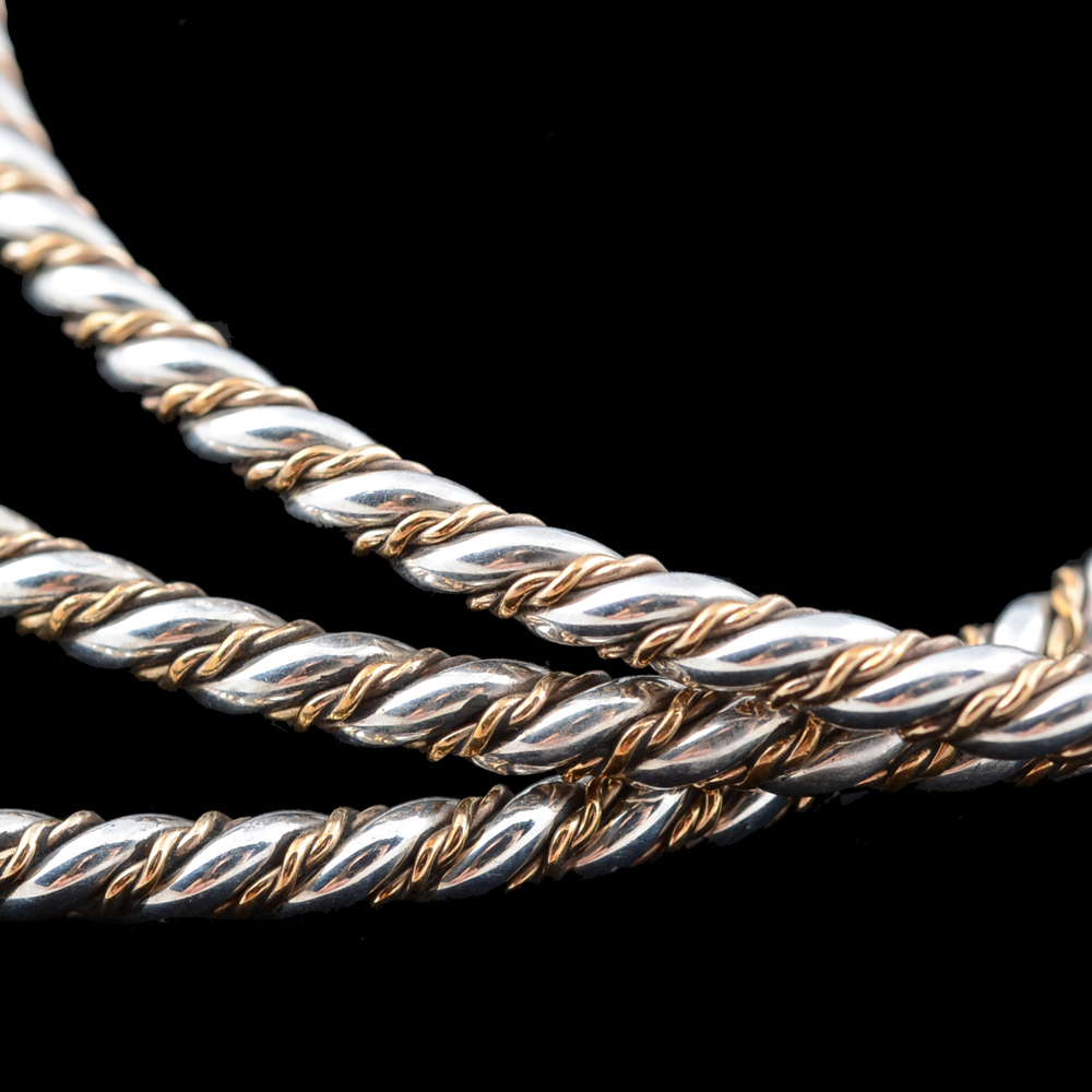 Collection of Two-Tone Twisted Bangle Bracelets