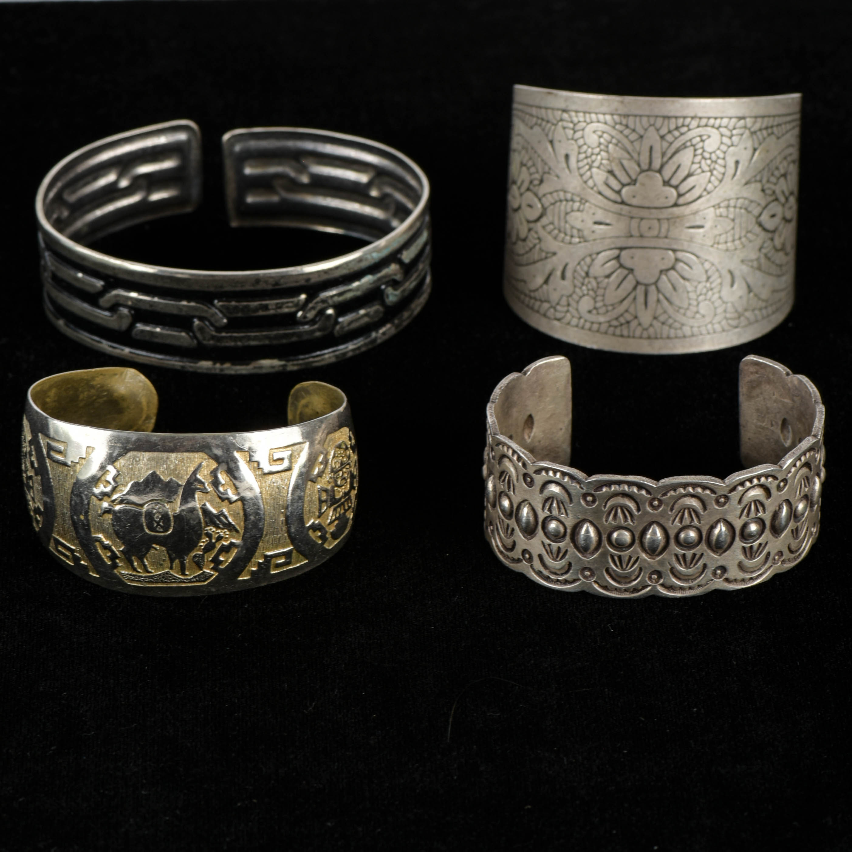 Four Silver Tone Cuff Bracelets