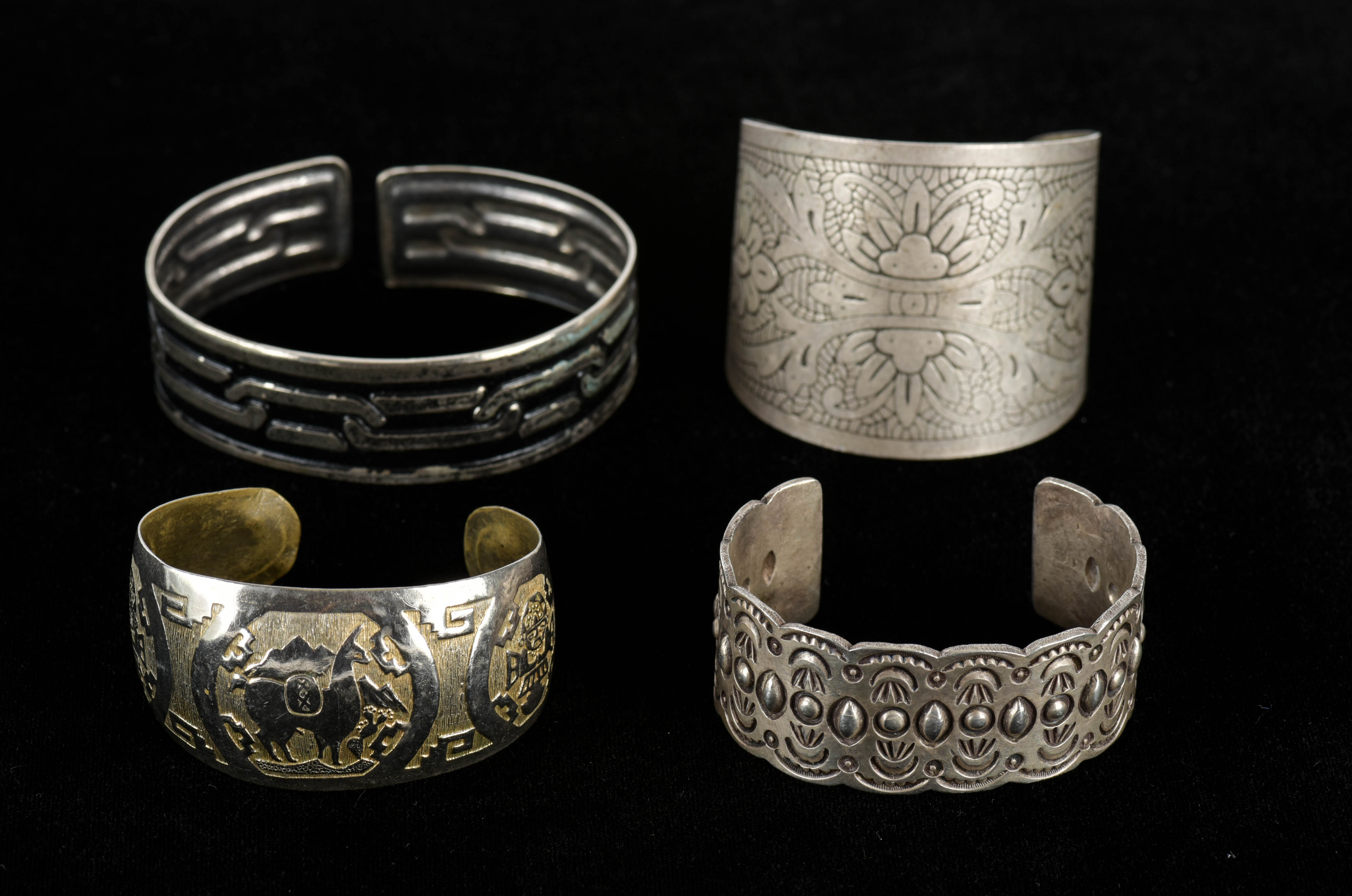 Four Silver Tone Cuff Bracelets