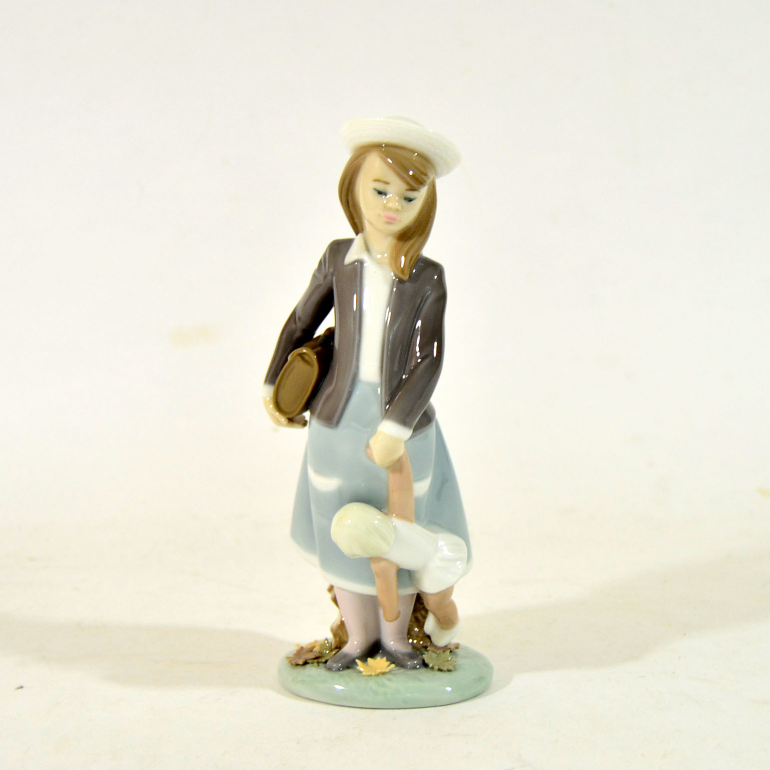 Retired Lladro "School Girl with Doll" Figurine
