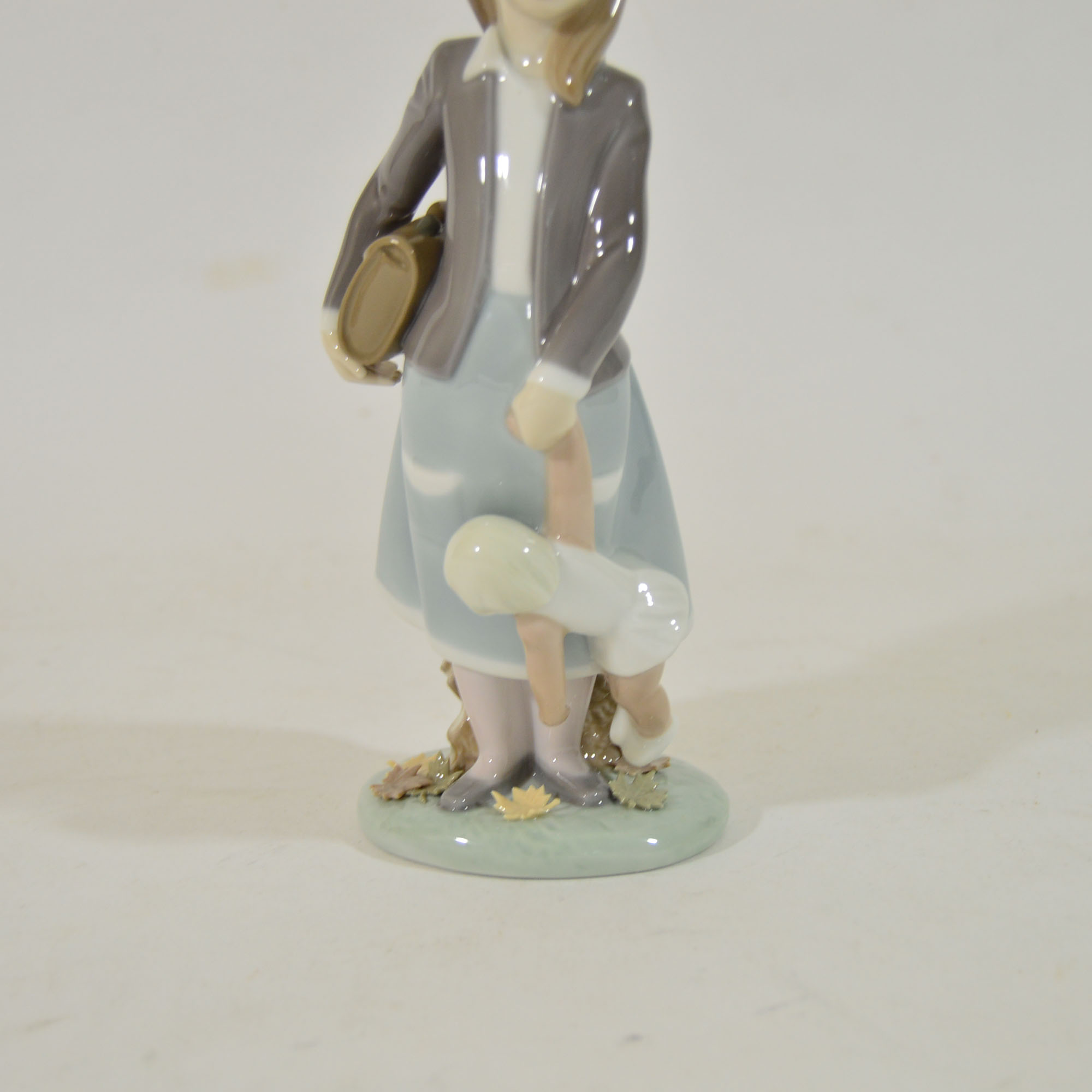 Retired Lladro "School Girl with Doll" Figurine
