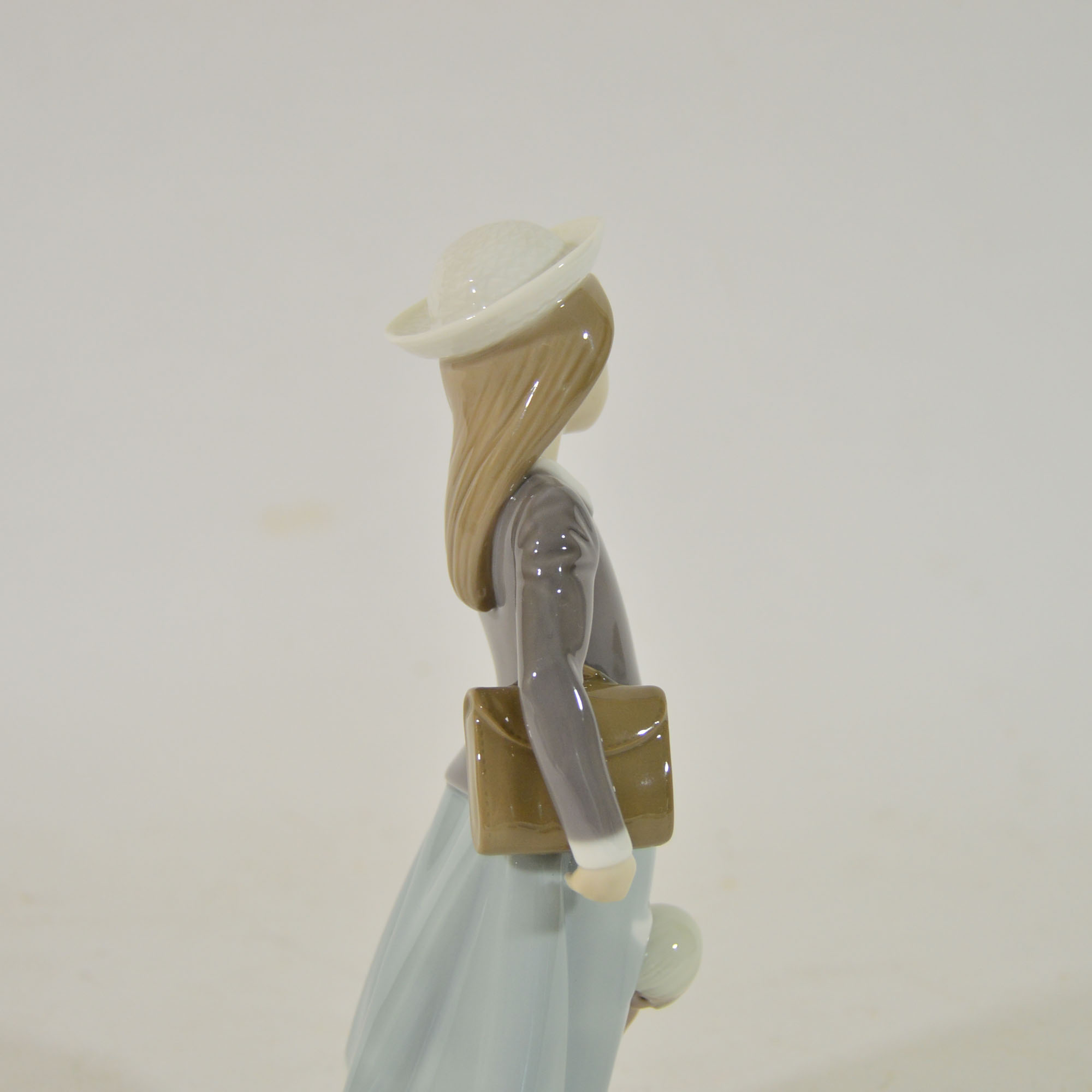 Retired Lladro "School Girl with Doll" Figurine