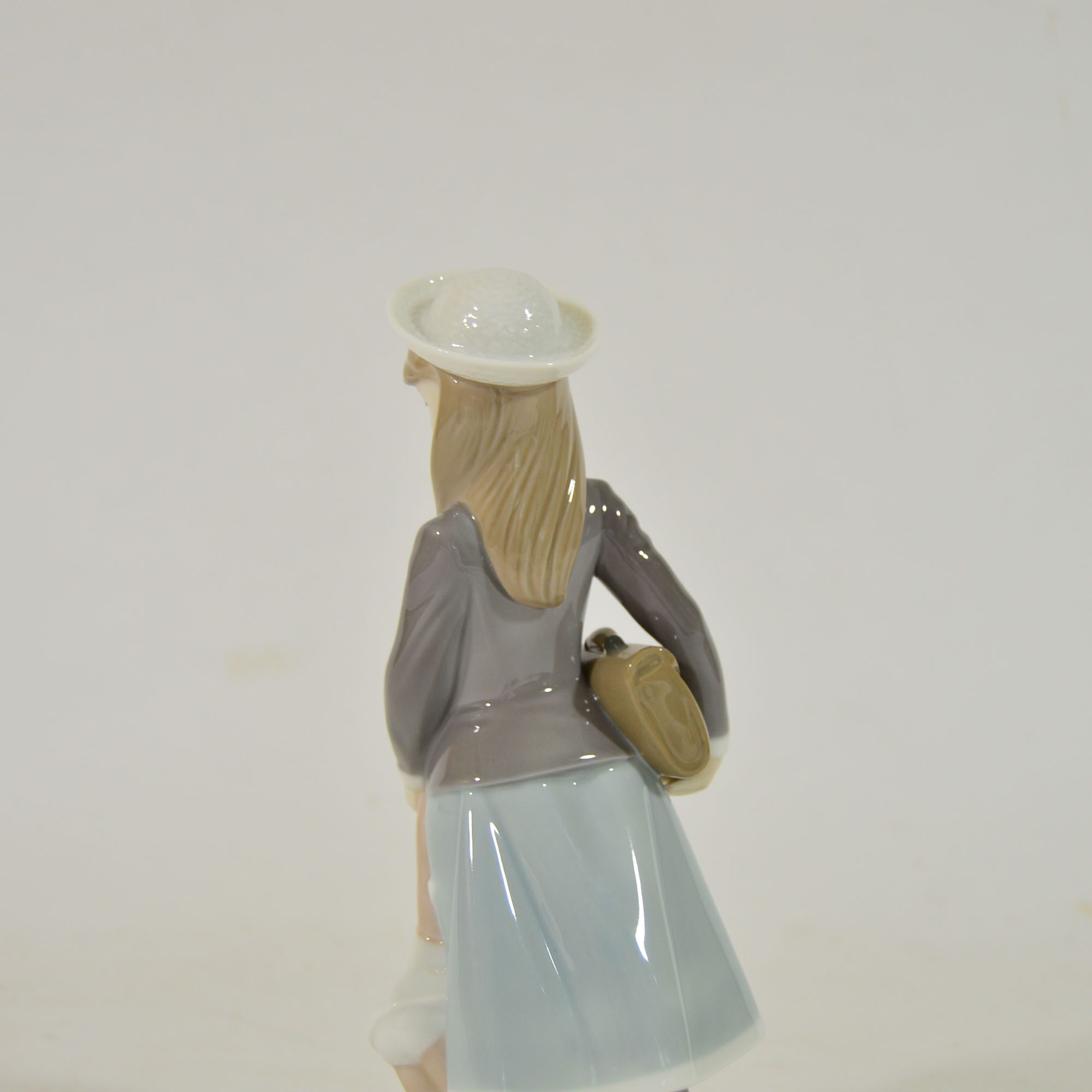 Retired Lladro "School Girl with Doll" Figurine