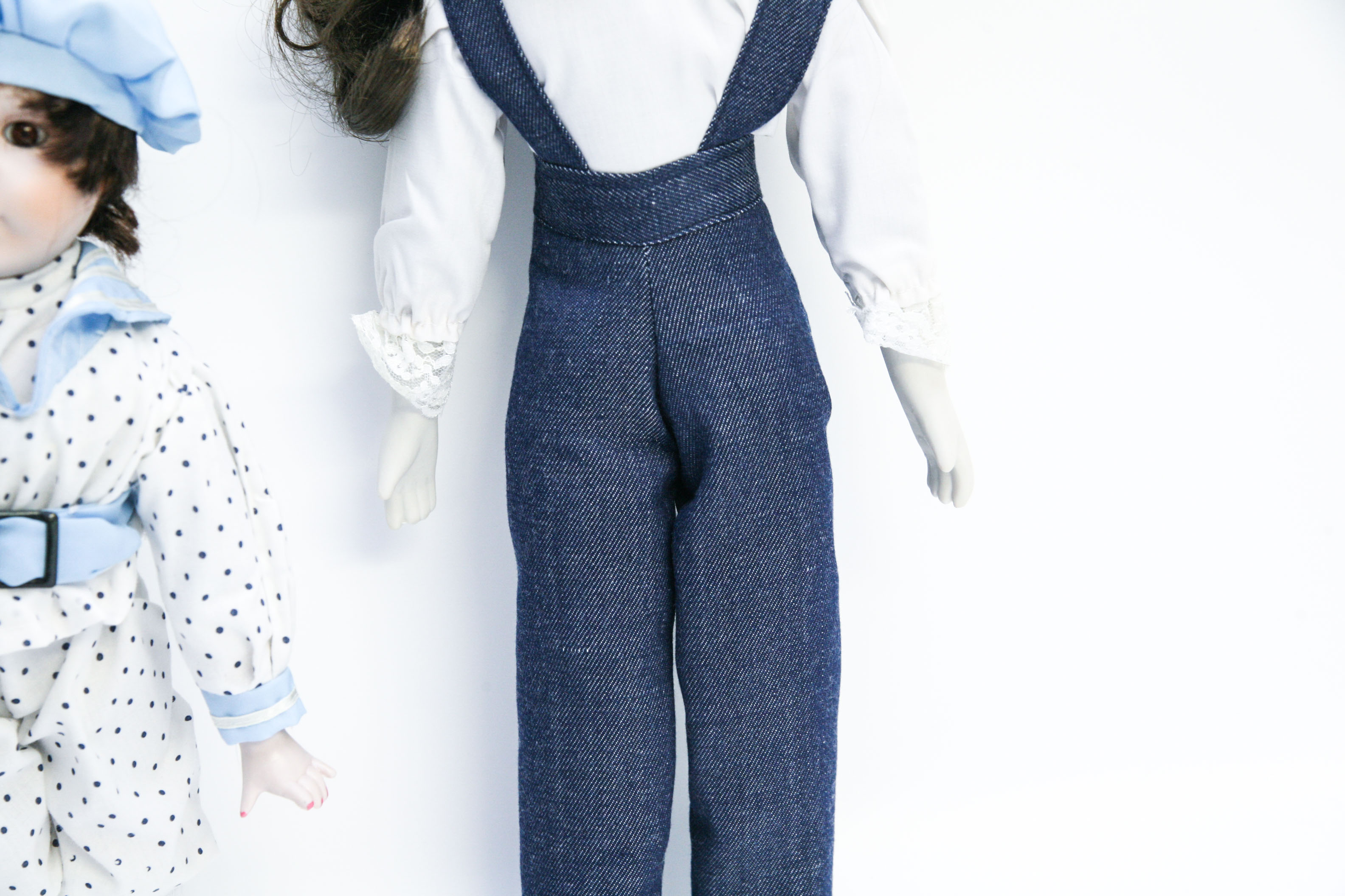 Two Porcelain Dolls in Menswear-Inspired Clothing