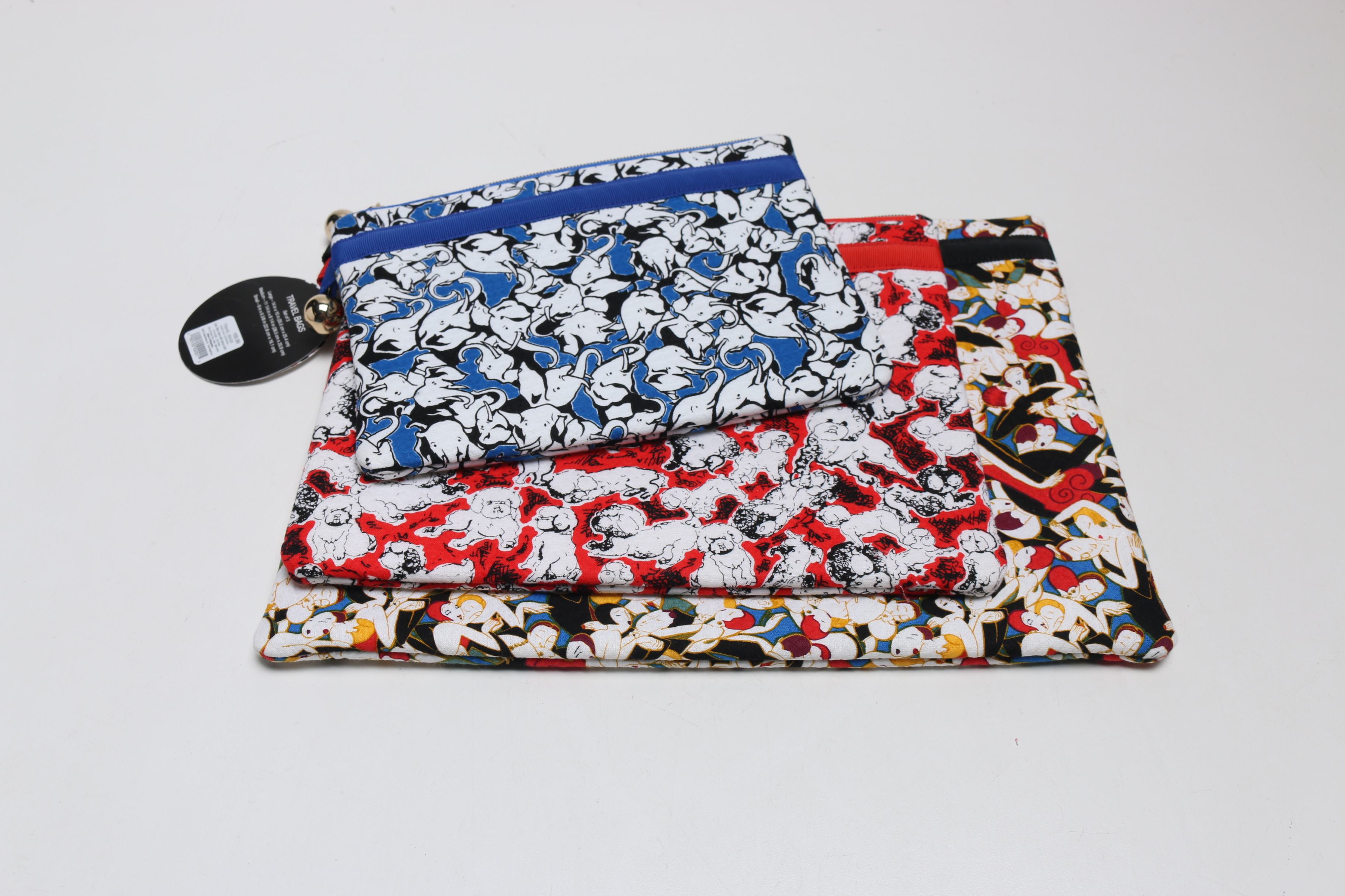 Group of Pouches and a Tory Burch Lunchbox