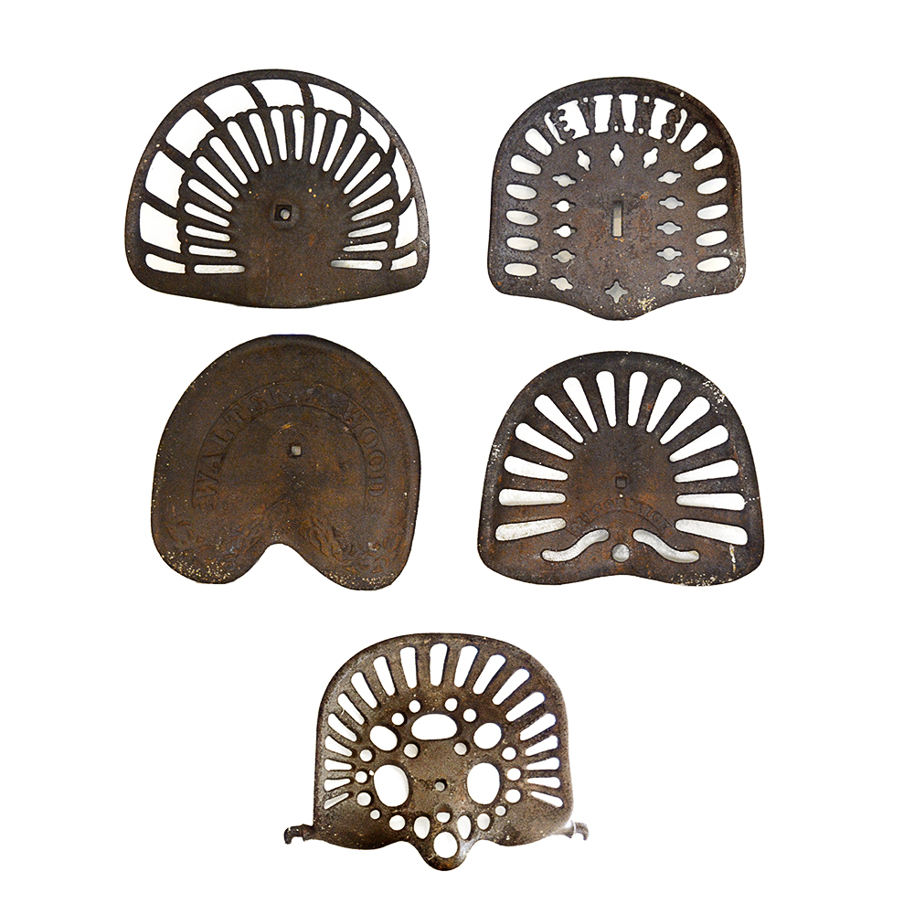 Five Vintage Cast Iron Tractor Seats