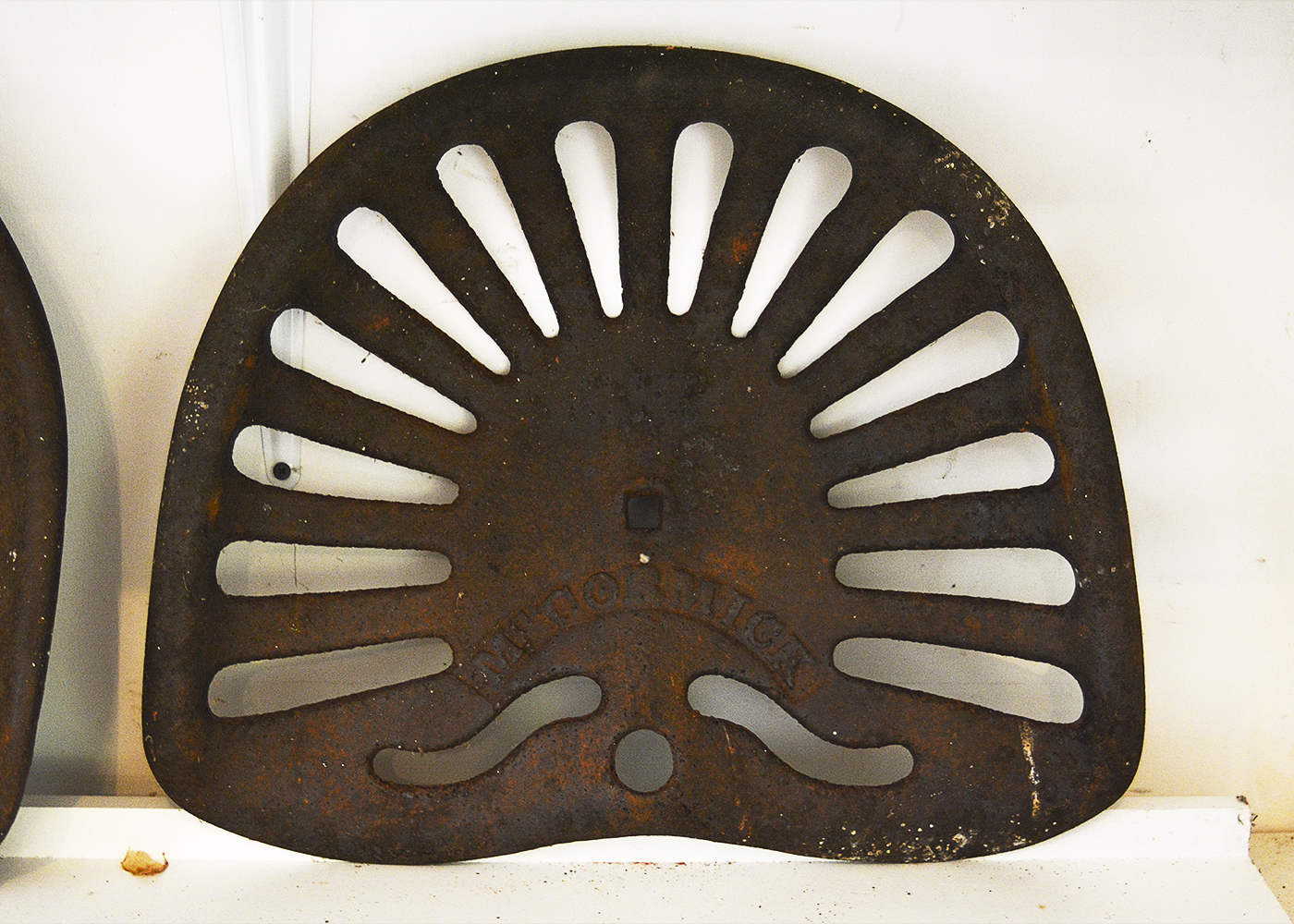 Five Vintage Cast Iron Tractor Seats