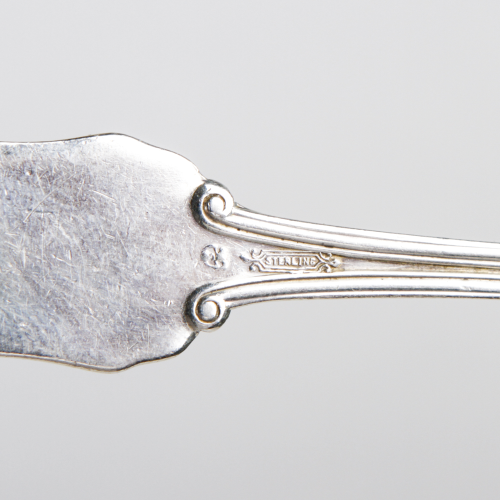 Collection of Sterling Spoons, Spreaders and a Serving Utensil