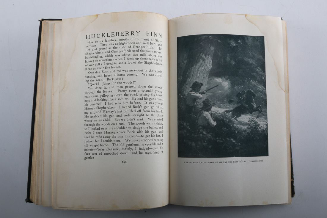 Collection of Four Vintage Books Including "Huckleberry Finn"