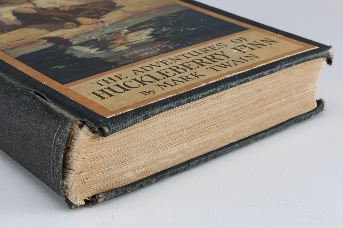 Collection of Four Vintage Books Including "Huckleberry Finn"