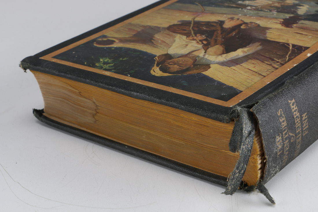 Collection of Four Vintage Books Including "Huckleberry Finn"