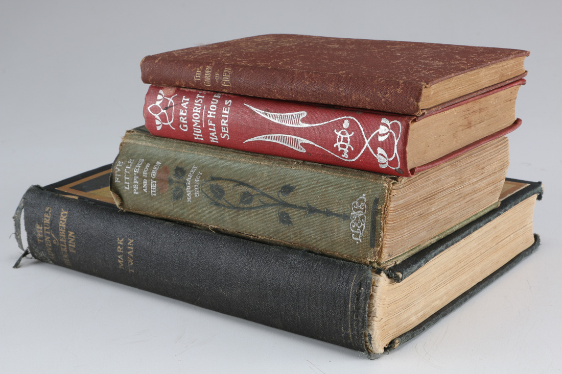 Collection of Four Vintage Books Including "Huckleberry Finn"