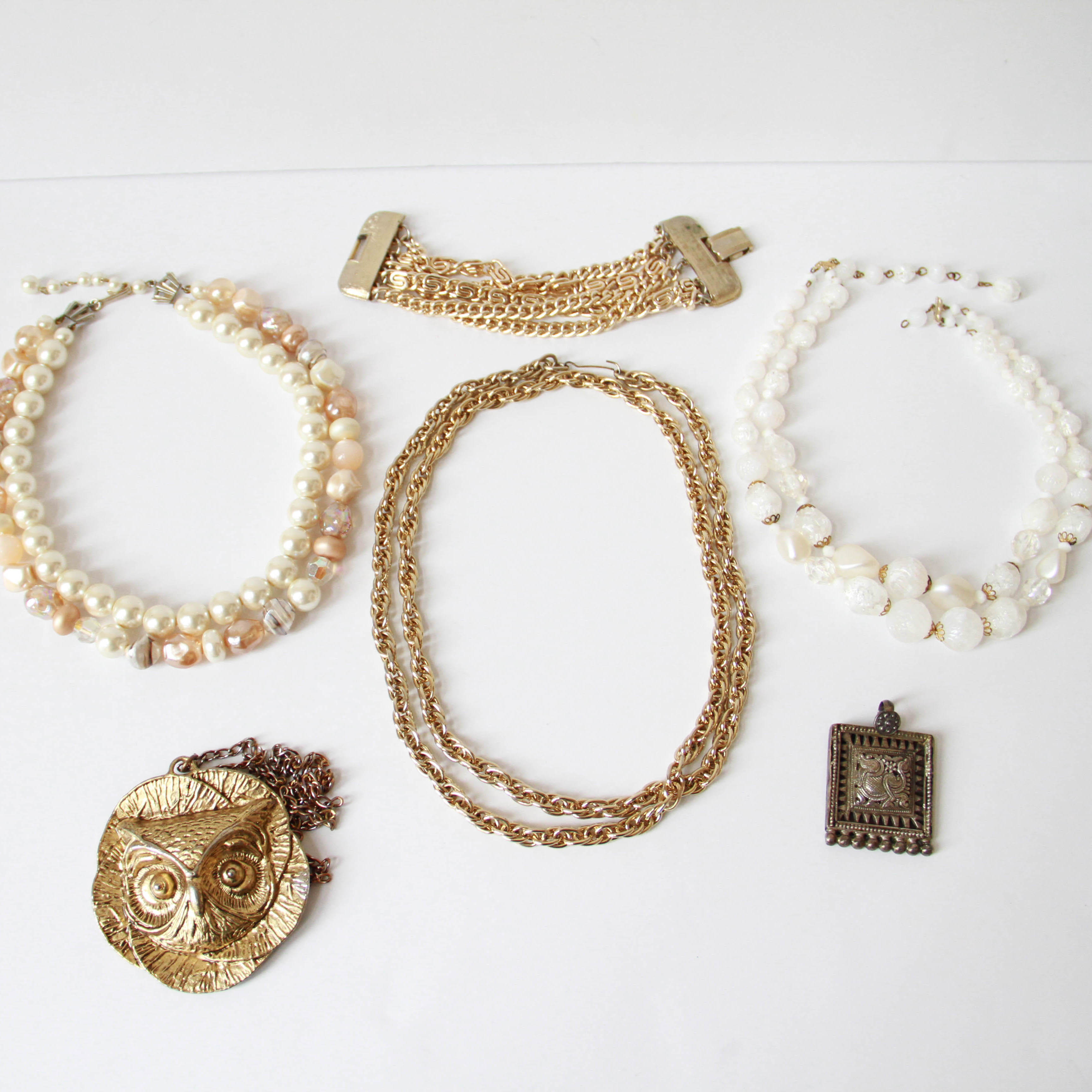 Assortment of White and Gold Tone Jewelry