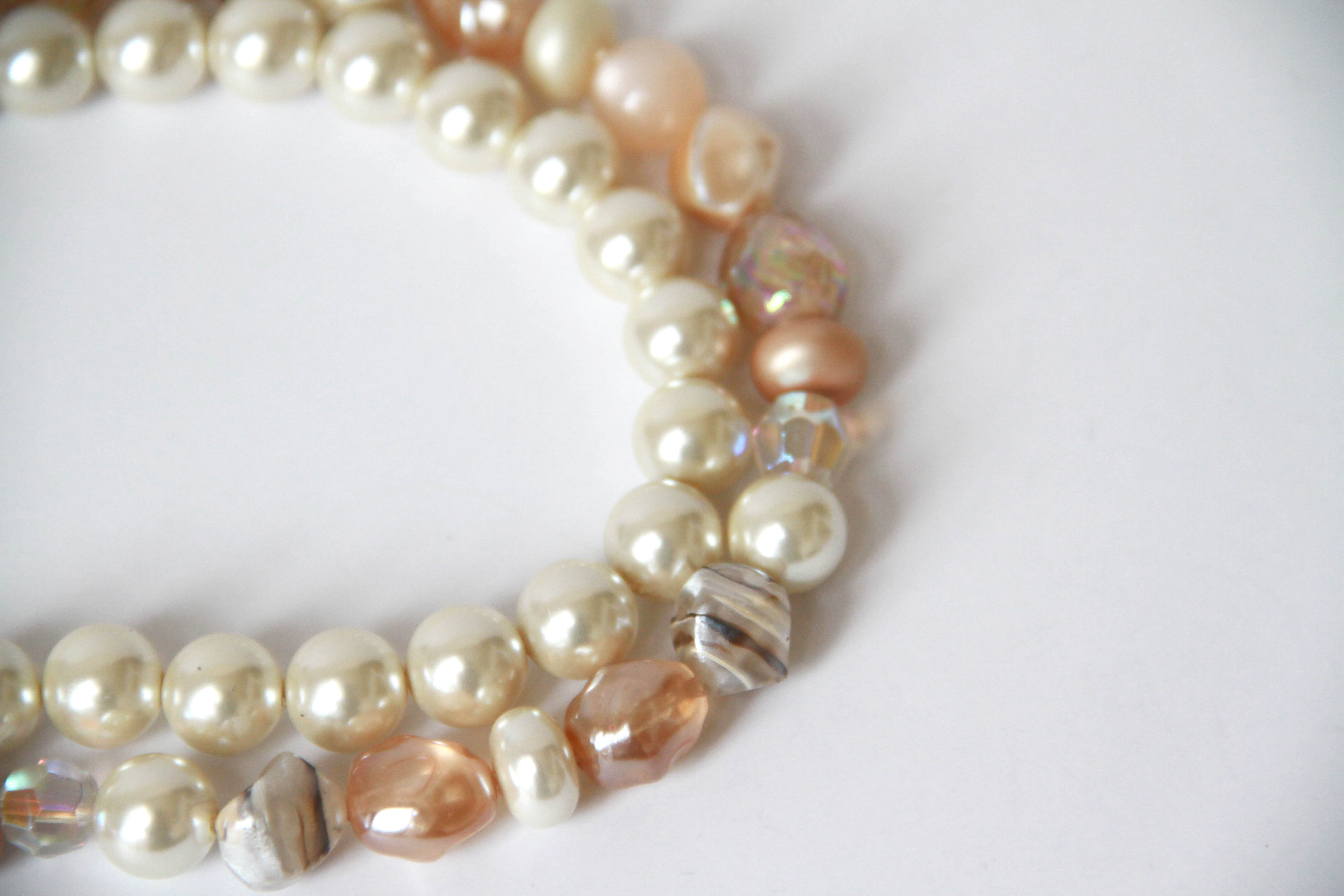 Assortment of White and Gold Tone Jewelry