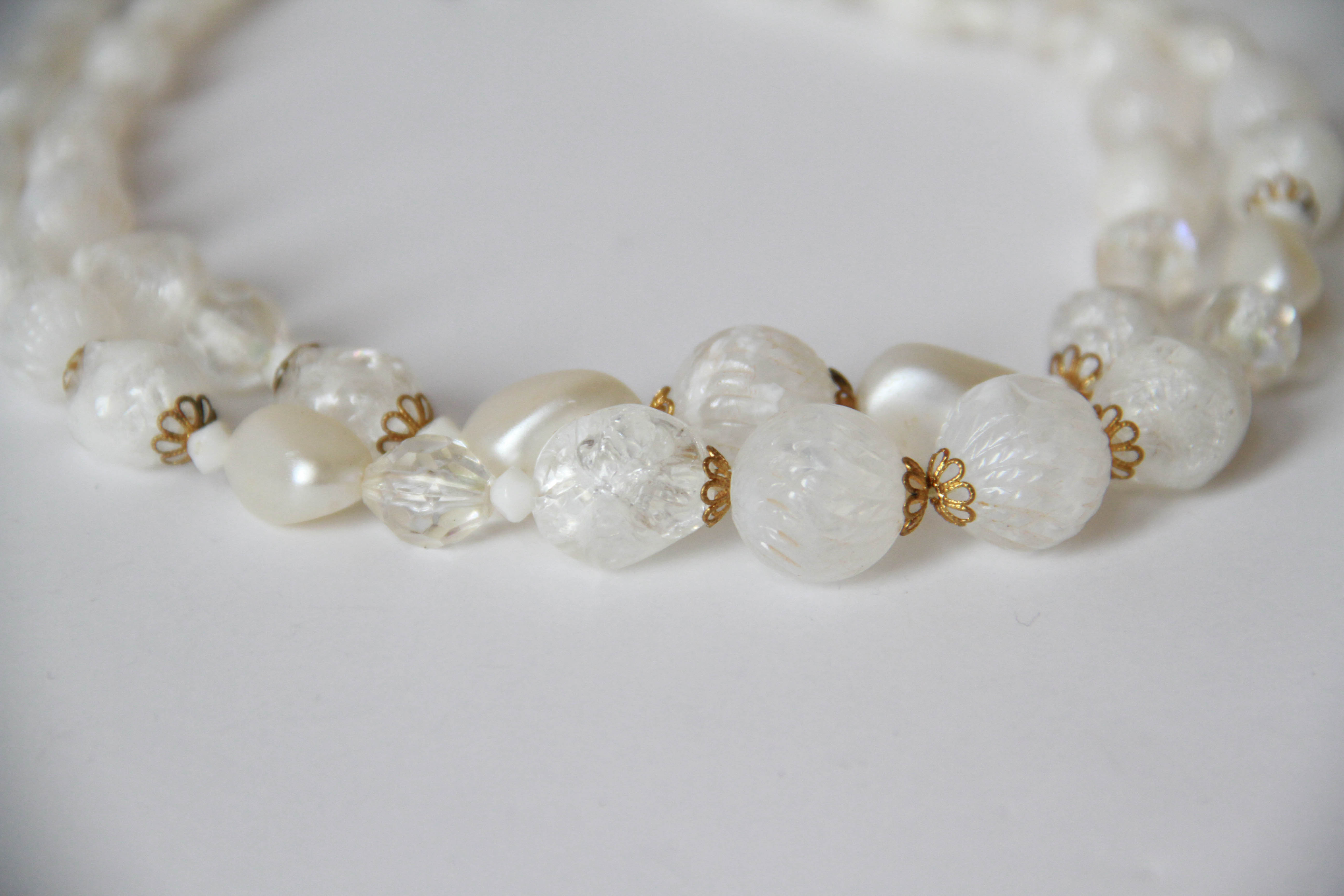 Assortment of White and Gold Tone Jewelry