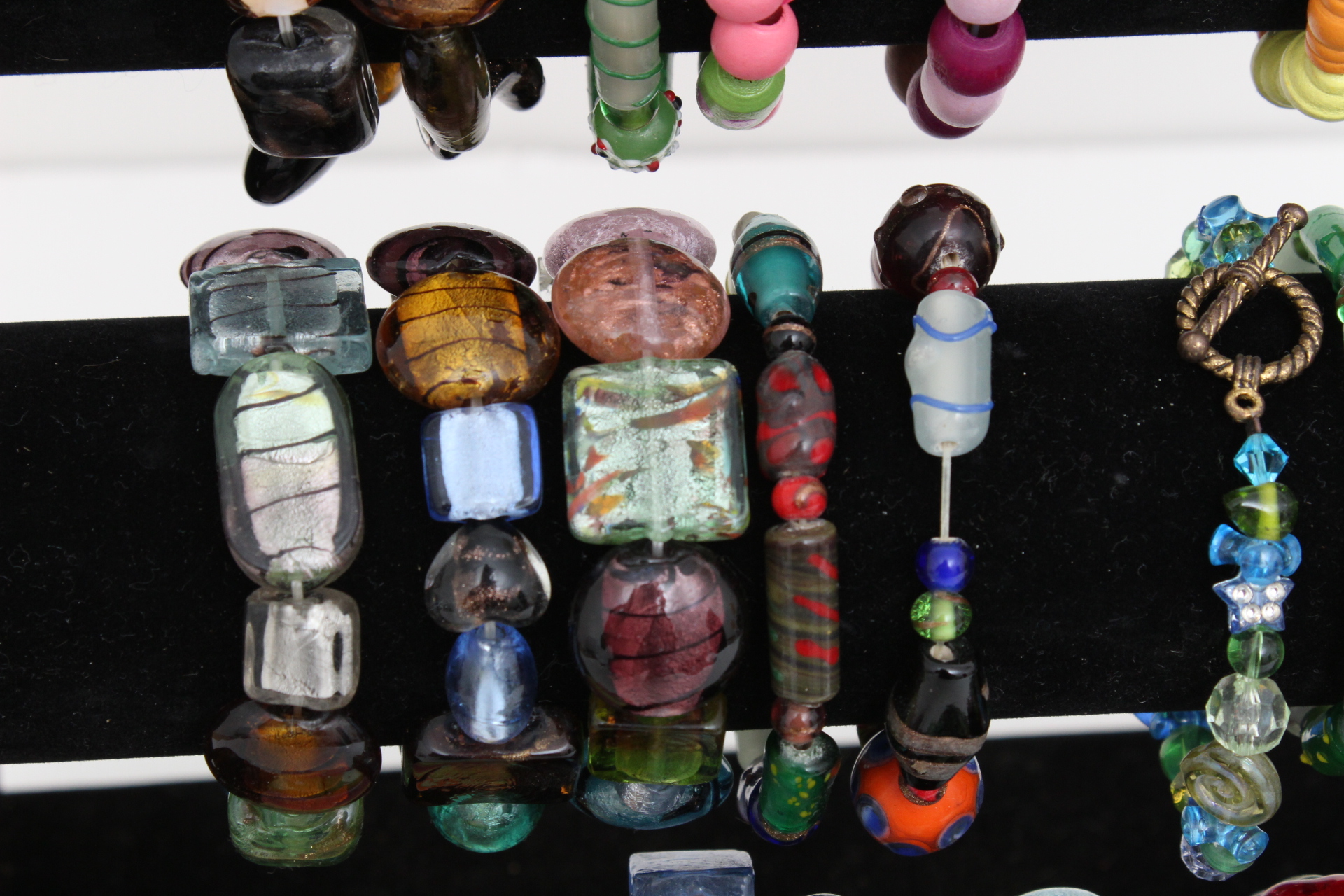 Collection of Beaded Bracelets with Jewelry Display Stand