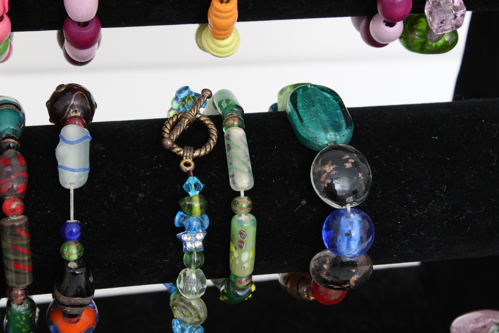 Collection of Beaded Bracelets with Jewelry Display Stand