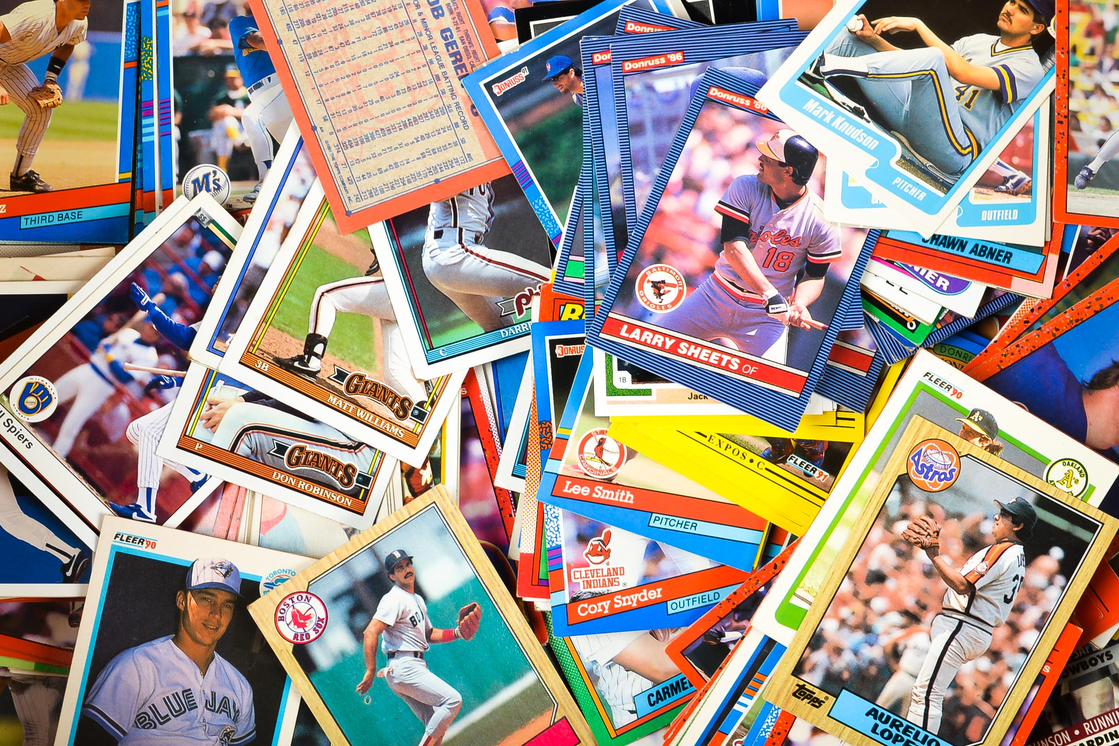 Assortment of Baseball Cards with NFL Cards