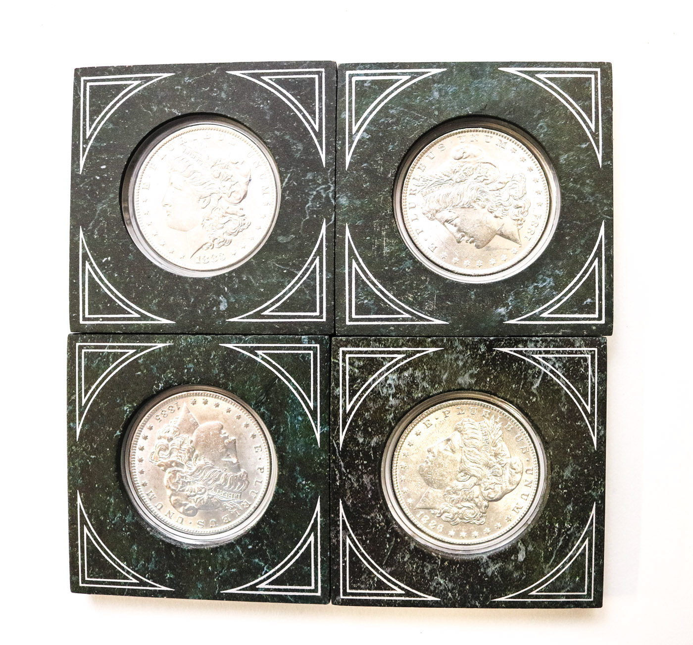 Collection of Sixteen Uncirculated Morgan Silver Dollars