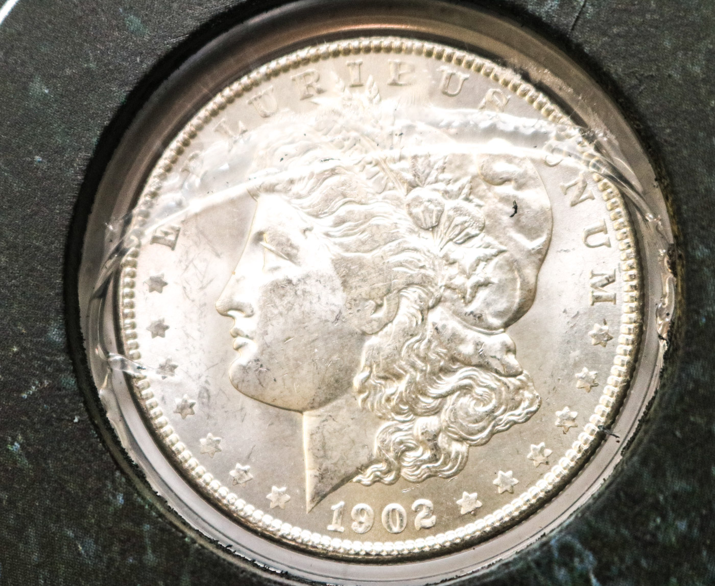 Collection of Sixteen Uncirculated Morgan Silver Dollars