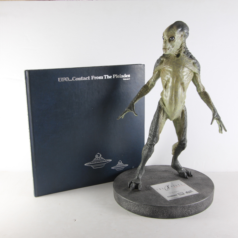 X-Files Alien Figurine and Book Titled "UFO...Contact From The Pleiades, Volume I"