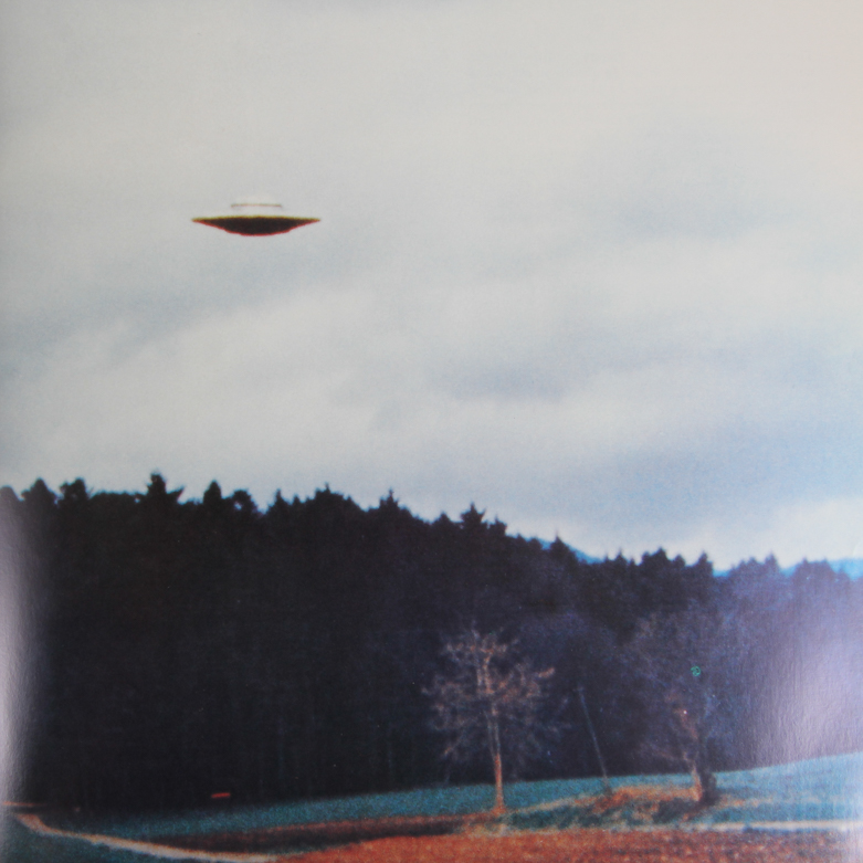 X-Files Alien Figurine and Book Titled "UFO...Contact From The Pleiades, Volume I"