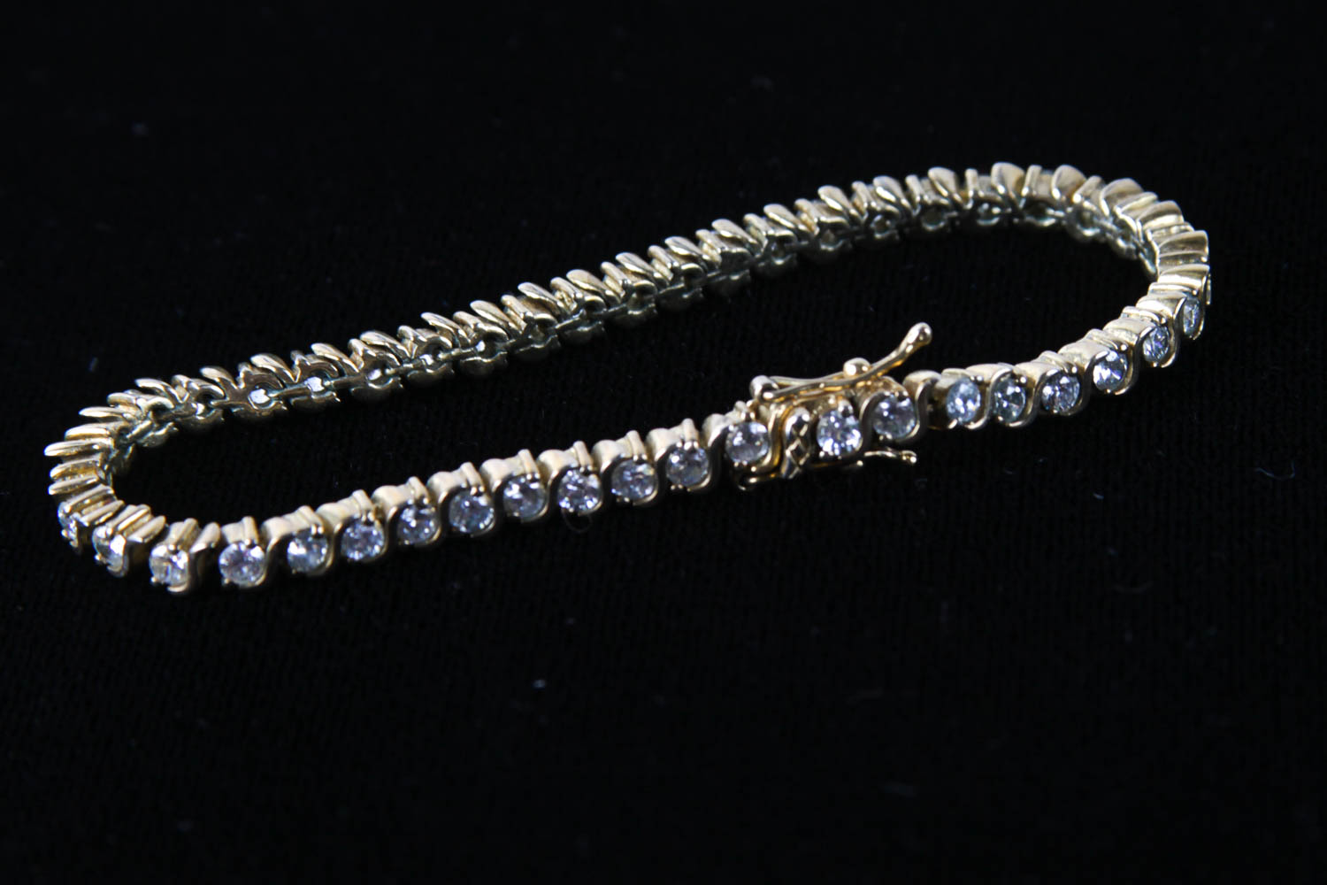 Collection of Four Sterling Silver and Crystal Bracelets