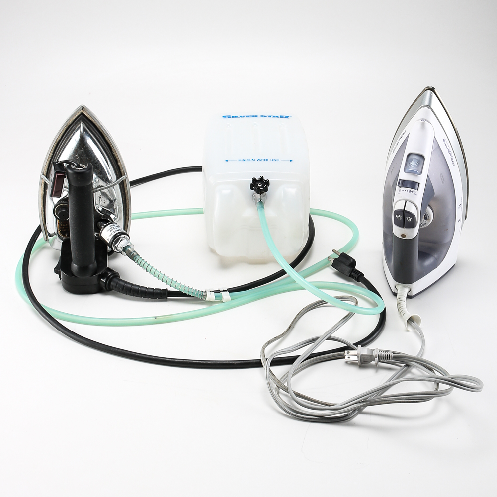 Pair of Clothes Irons and a Hanging Rack