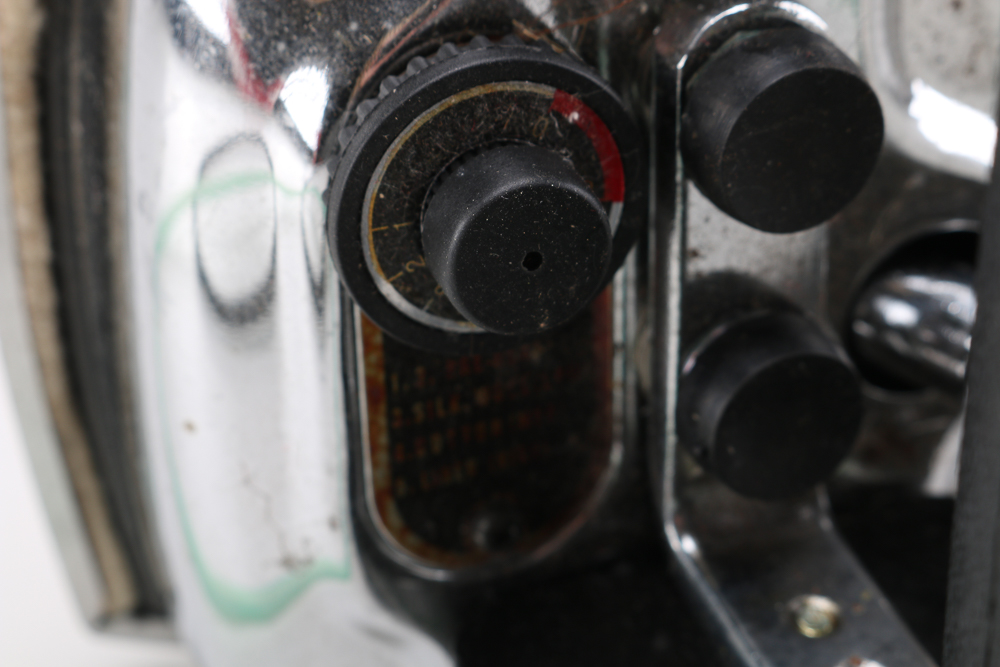 Pair of Clothes Irons and a Hanging Rack