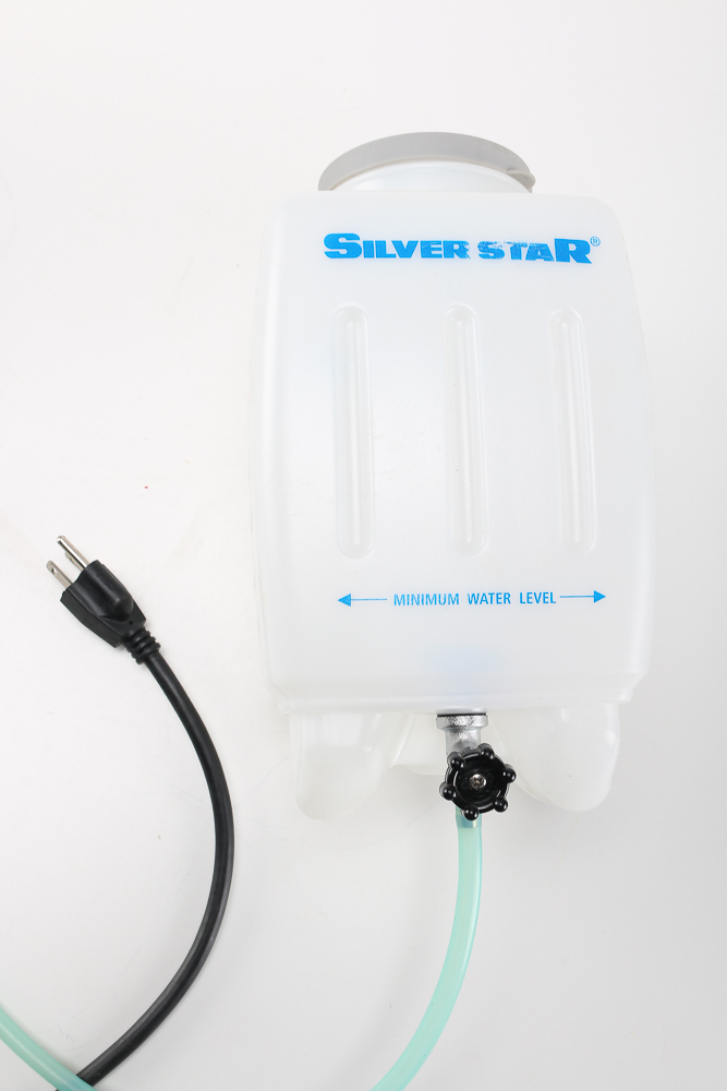 Pair of Clothes Irons and a Hanging Rack