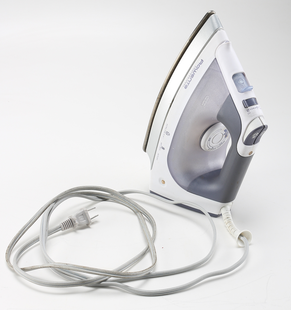 Pair of Clothes Irons and a Hanging Rack