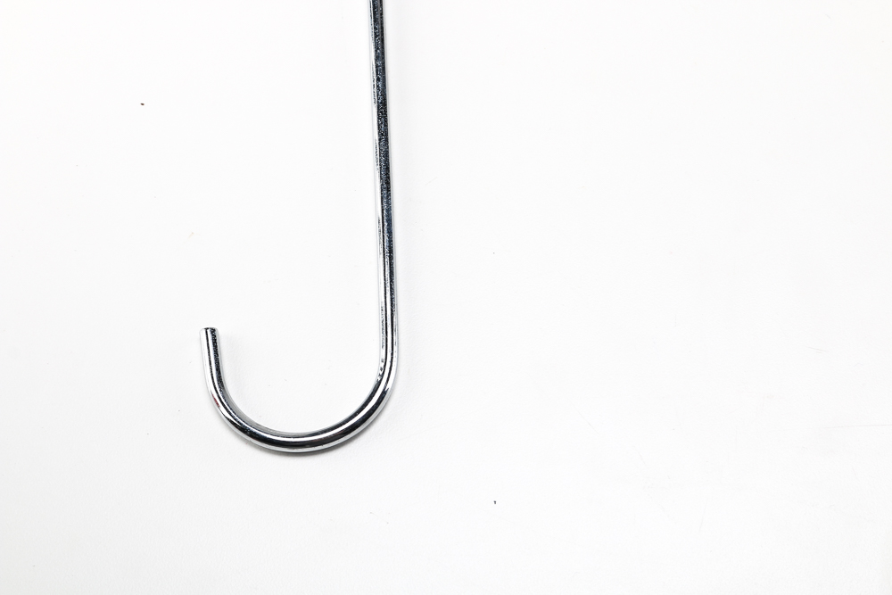 Pair of Clothes Irons and a Hanging Rack