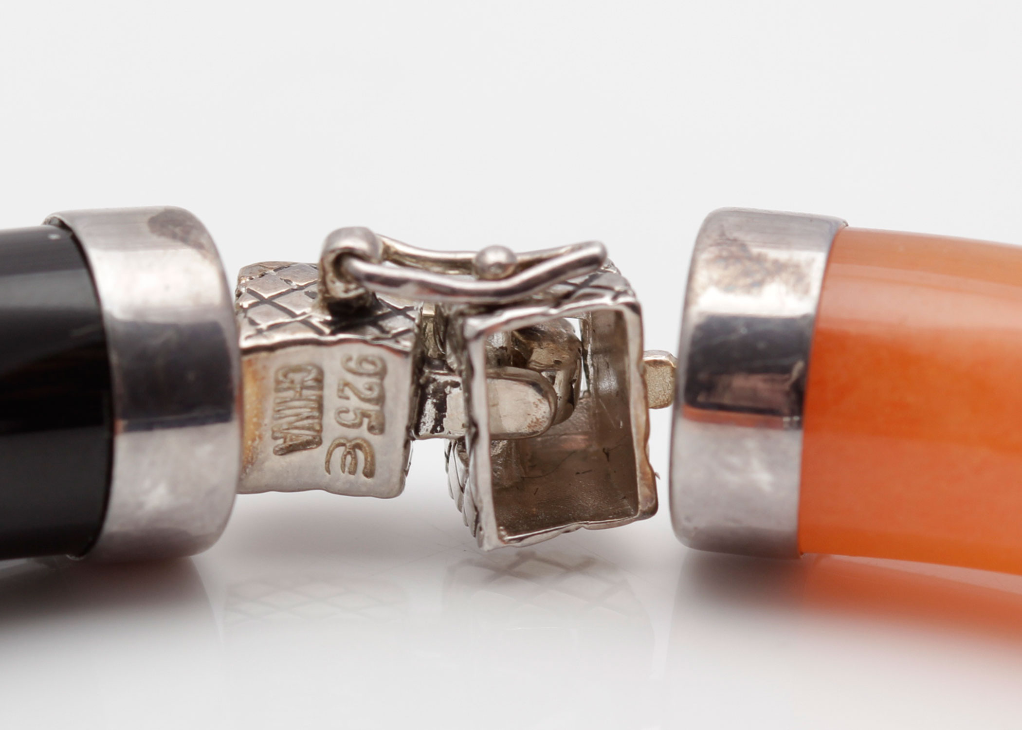 Sterling Silver Bracelet with Orange Jadeite and Black Onyx