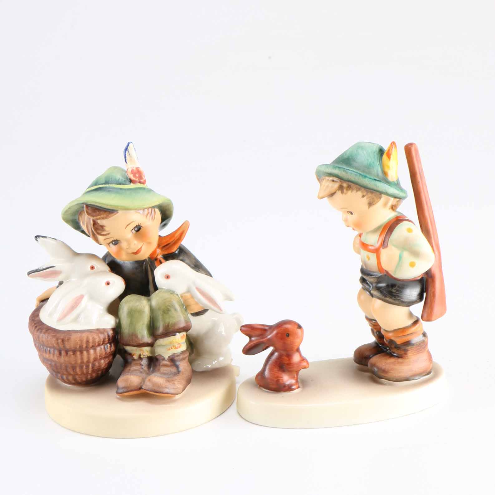 Pair of Hummel Porcelain Figurines "Sensitive Hunter" and "Playmates"