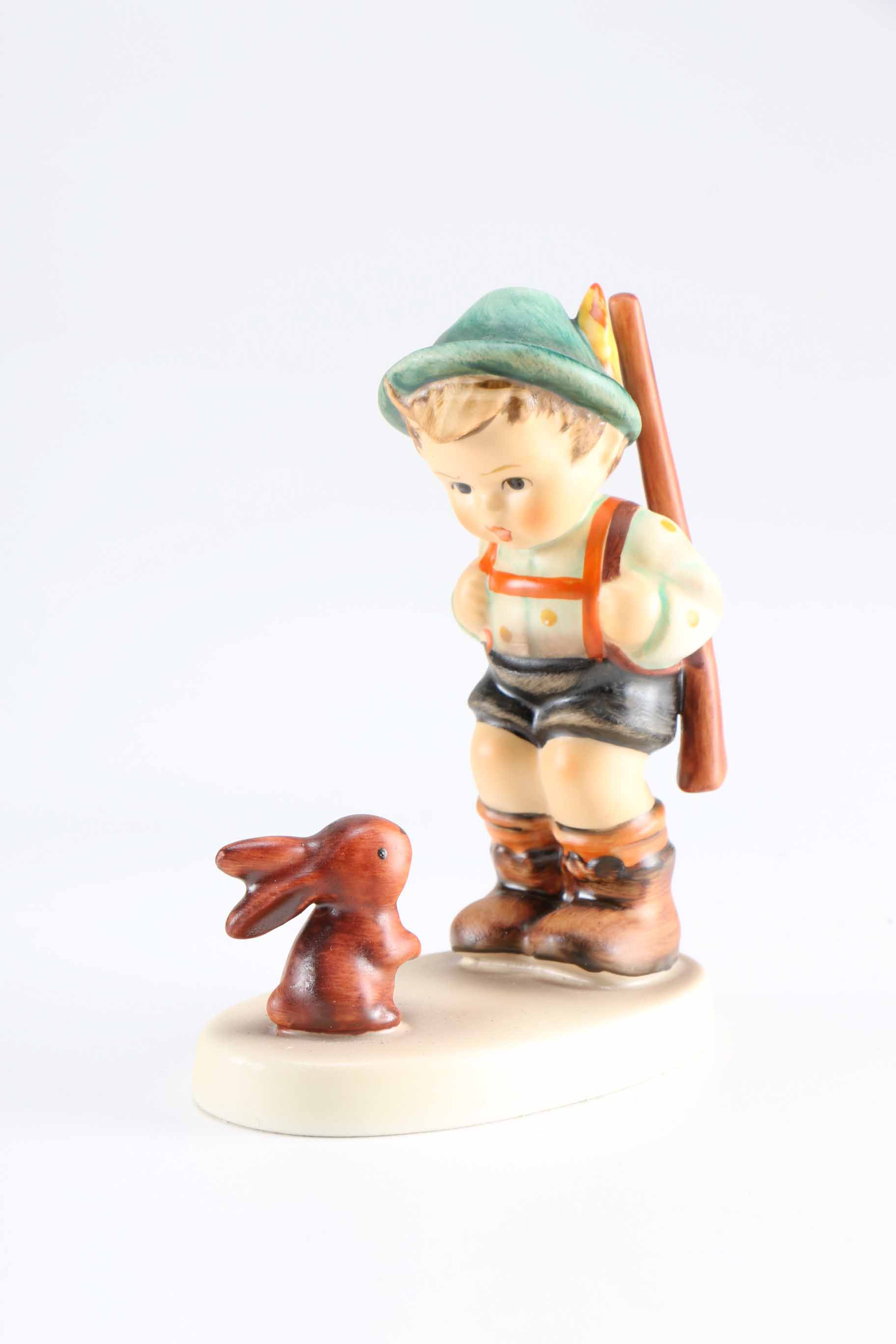 Pair of Hummel Porcelain Figurines "Sensitive Hunter" and "Playmates"