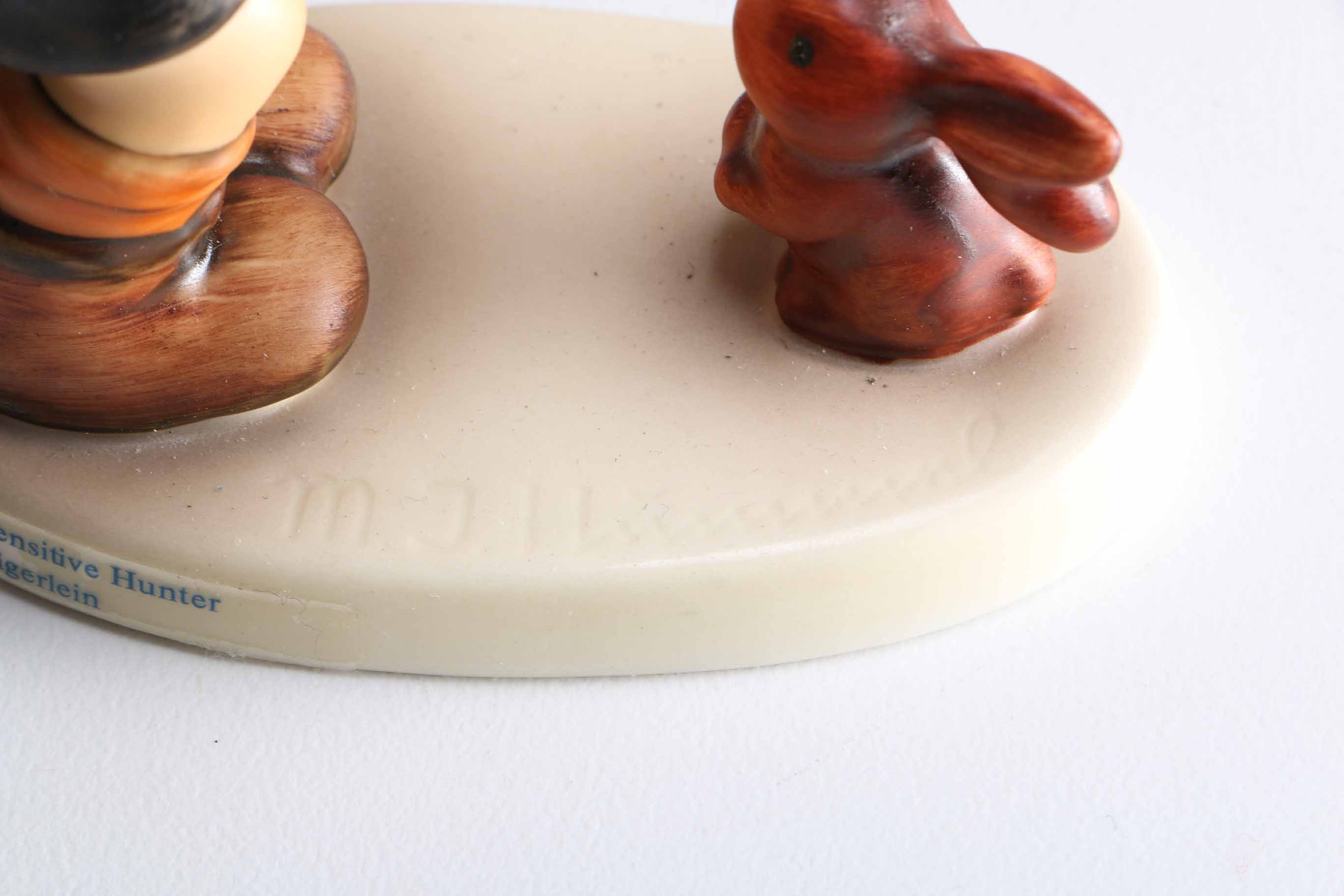 Pair of Hummel Porcelain Figurines "Sensitive Hunter" and "Playmates"