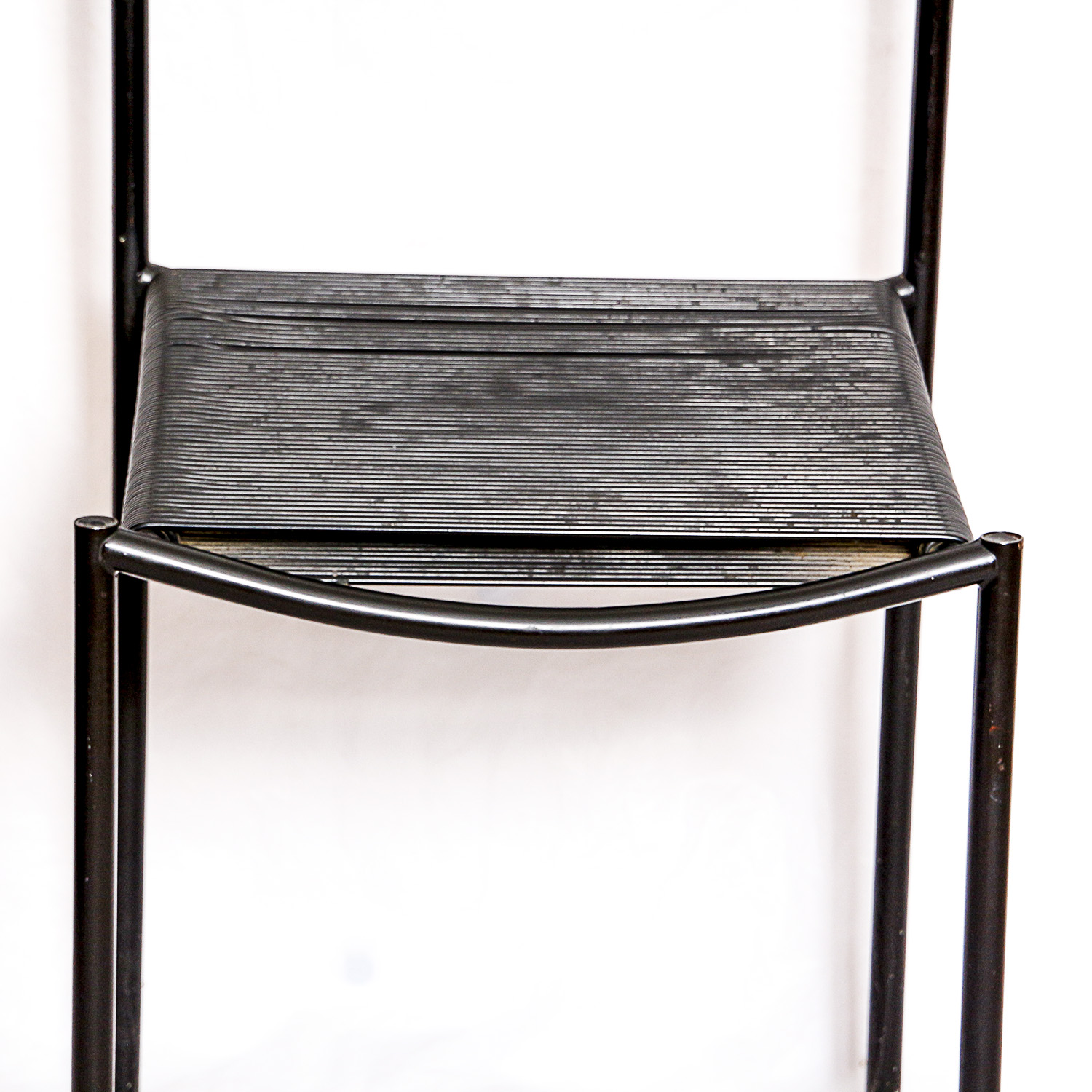 Two Black Metal Frame Chairs with Rubber Cord Seats