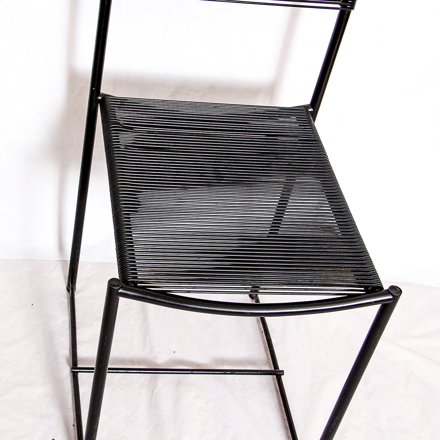 Two Black Metal Frame Chairs with Rubber Cord Seats
