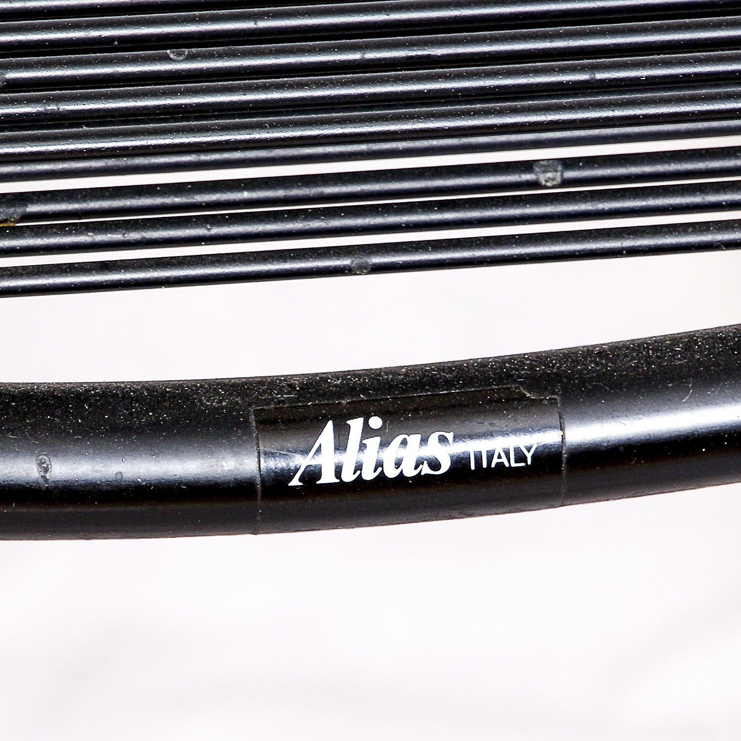 Two Black Metal Frame Chairs with Rubber Cord Seats