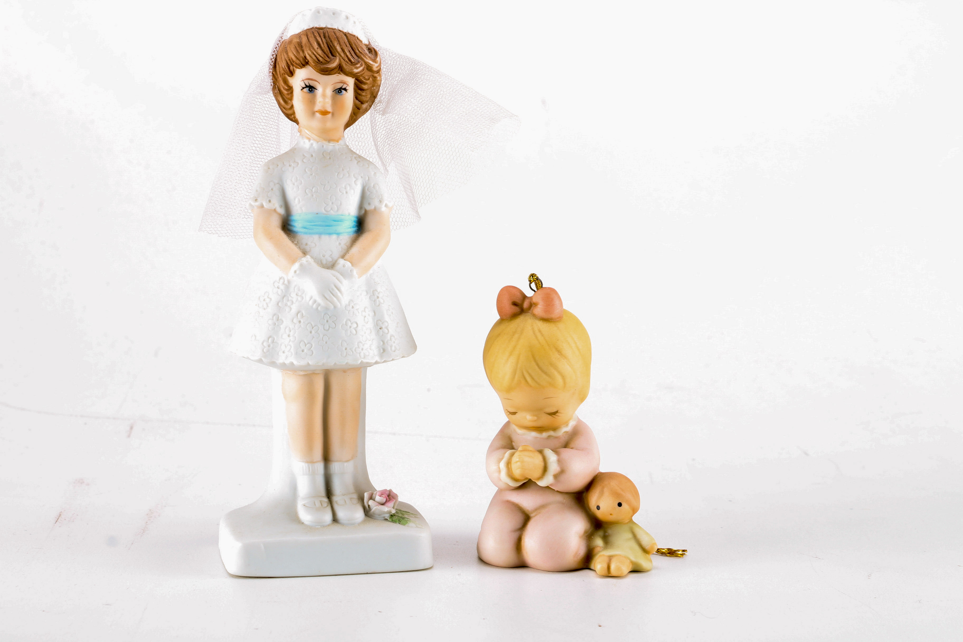 Figurines from Enesco, Madam Alexander, and Almost Angels