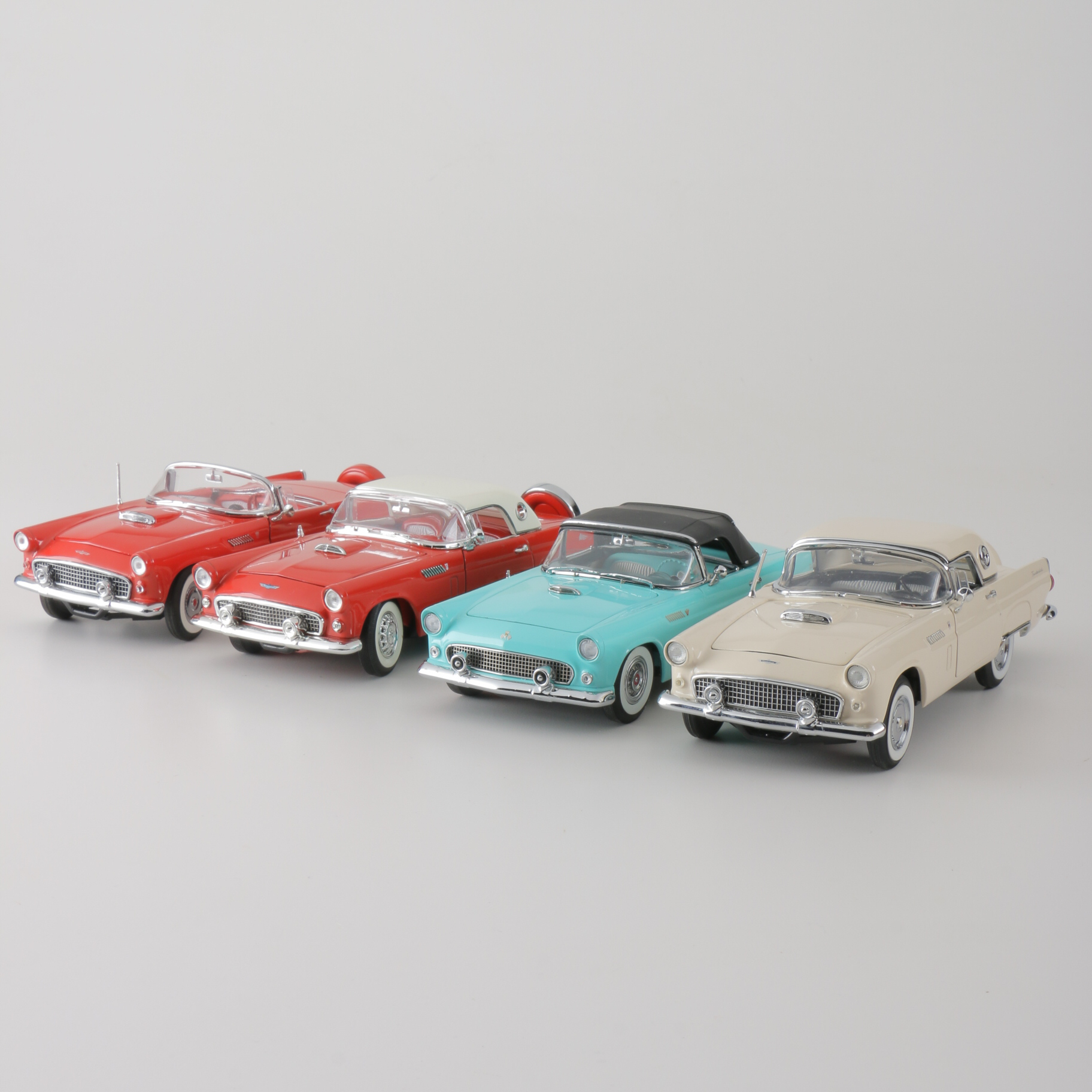 A collection of Four 1:24 Scale Ford Thunderbirds
