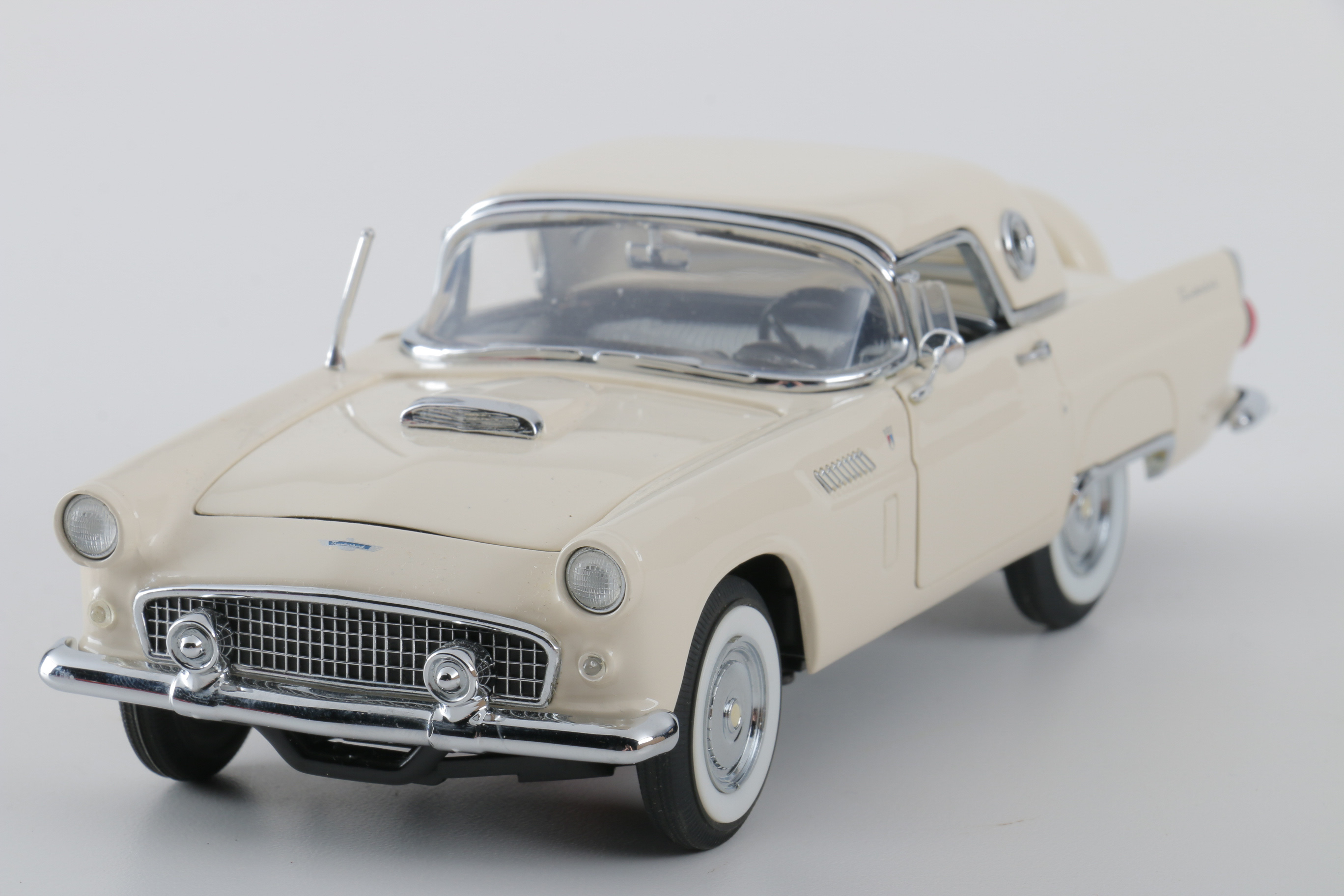 A collection of Four 1:24 Scale Ford Thunderbirds