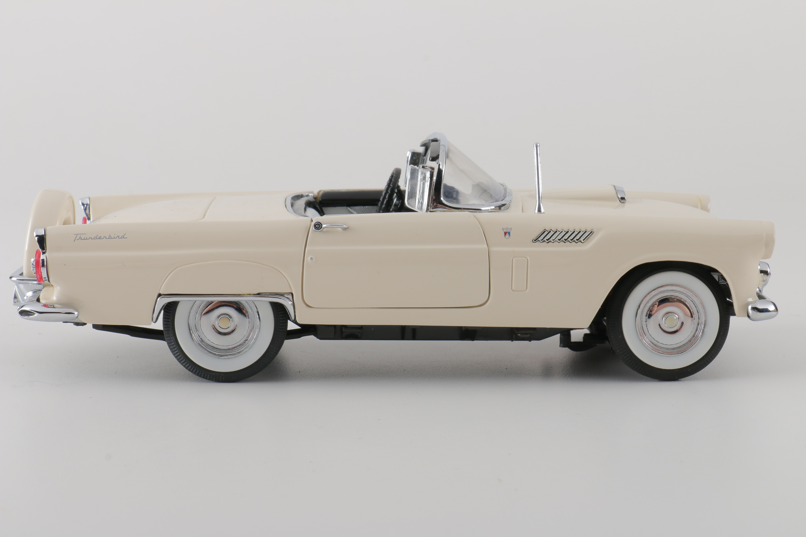 A collection of Four 1:24 Scale Ford Thunderbirds