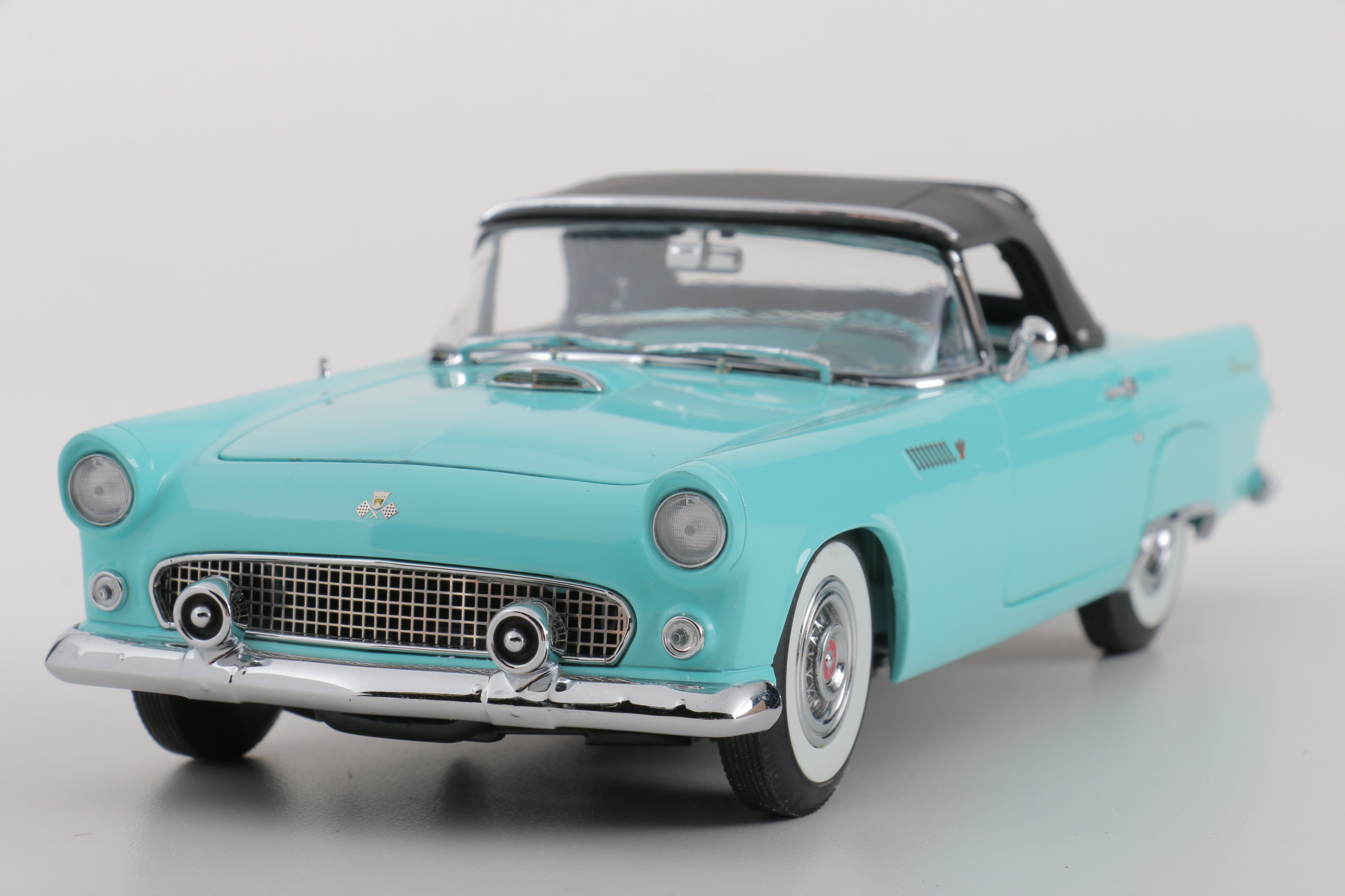 A collection of Four 1:24 Scale Ford Thunderbirds