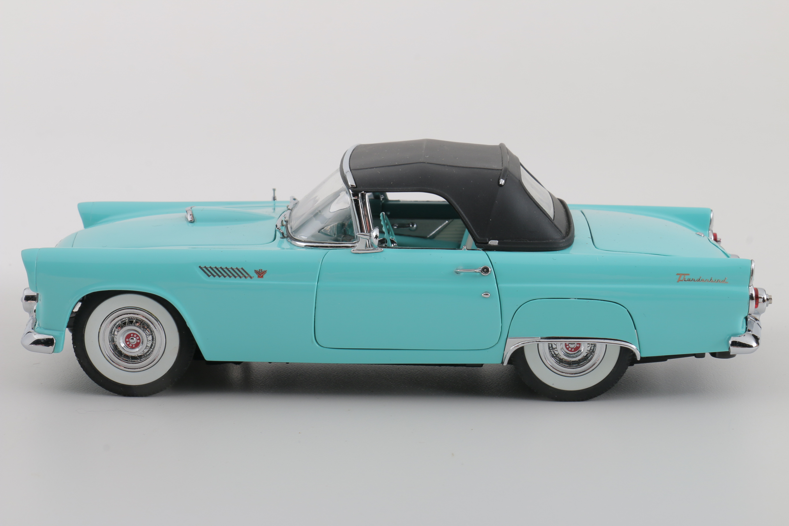 A collection of Four 1:24 Scale Ford Thunderbirds