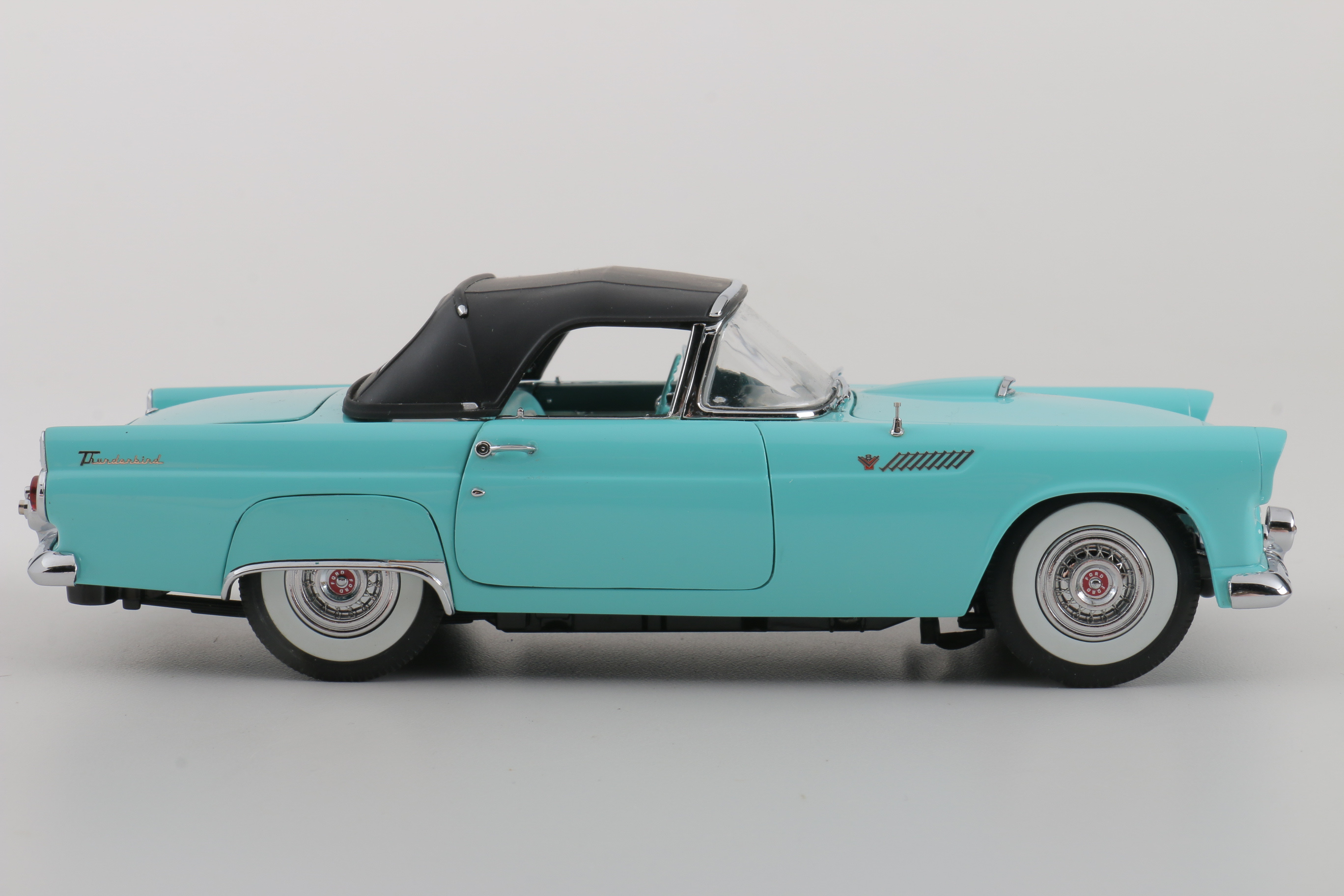 A collection of Four 1:24 Scale Ford Thunderbirds