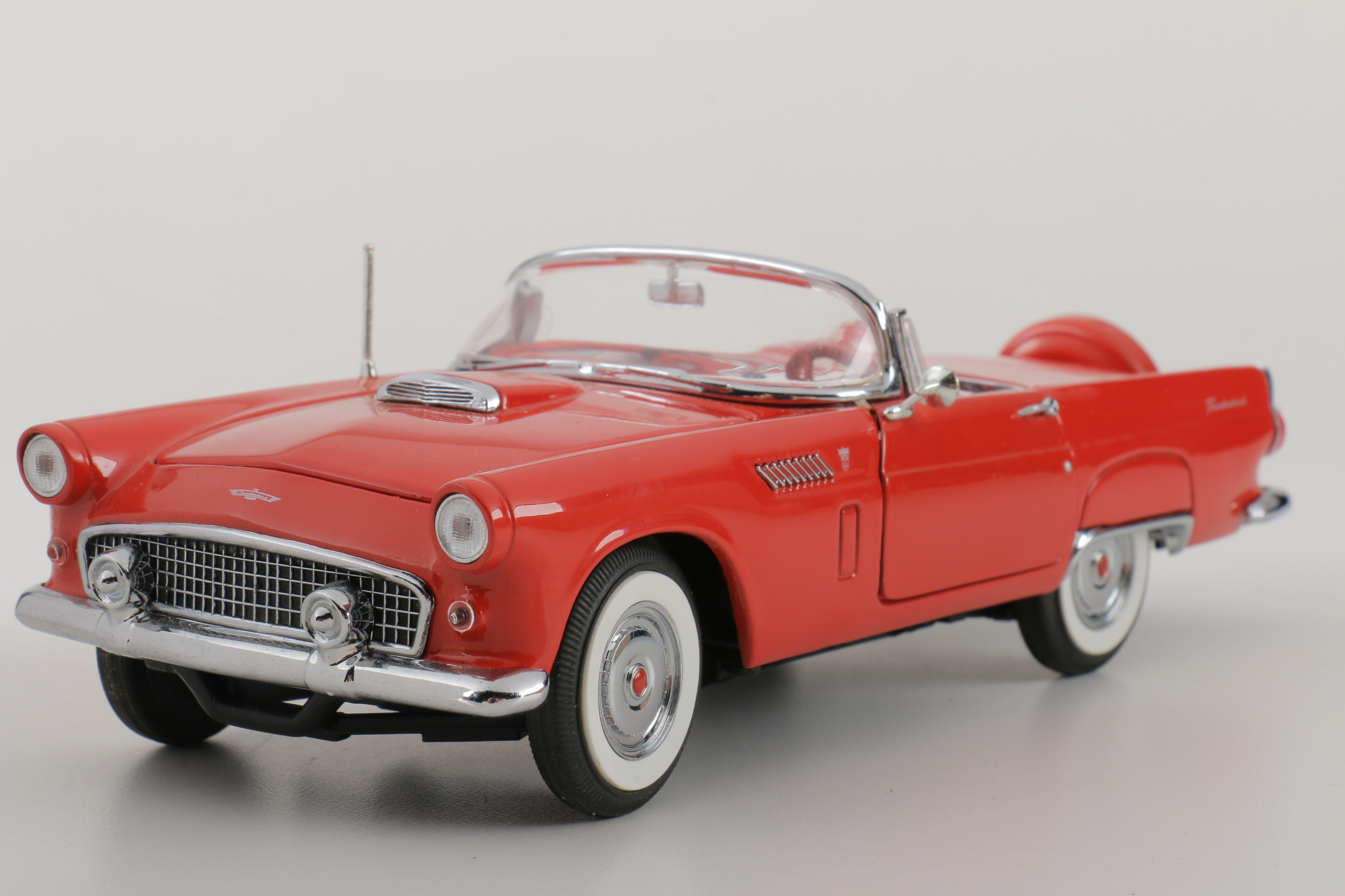 A collection of Four 1:24 Scale Ford Thunderbirds