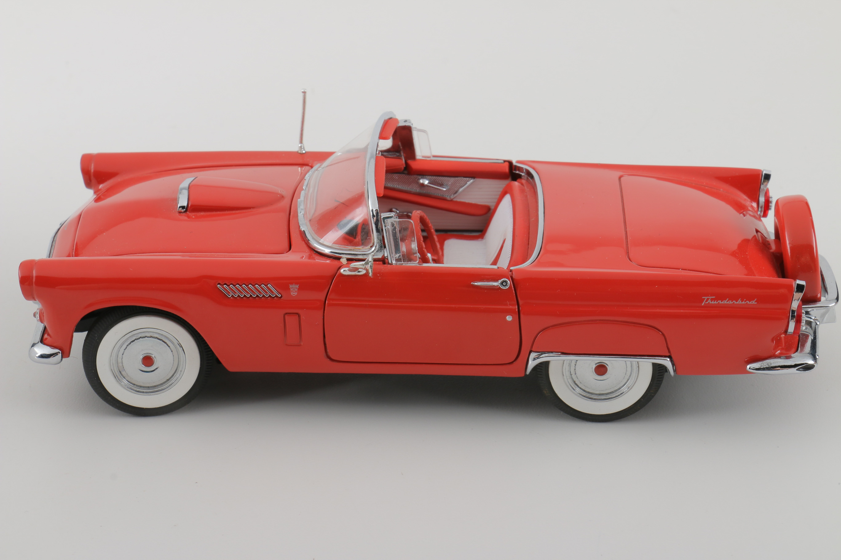 A collection of Four 1:24 Scale Ford Thunderbirds